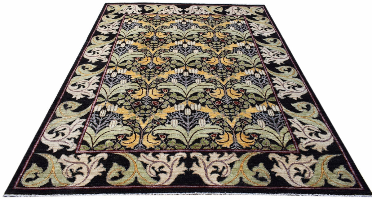 A handwoven Afghan wool rug featuring a black background with a repeating botanical floral pattern.