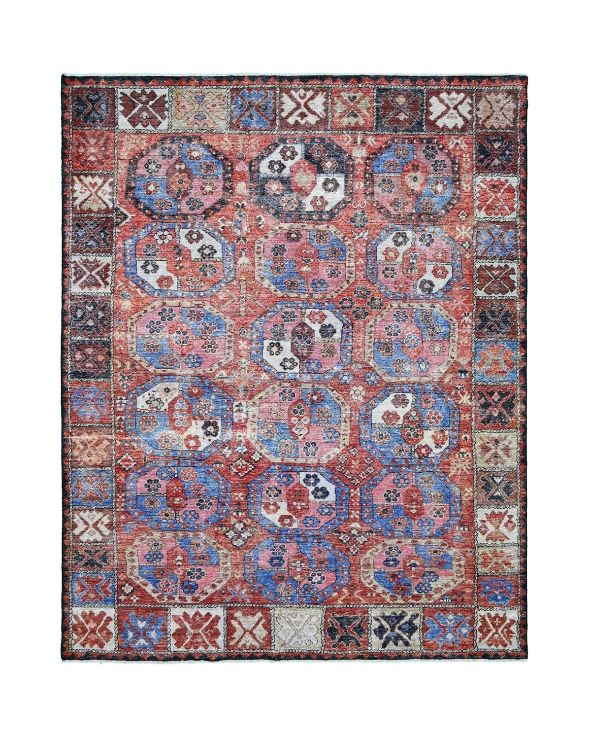 Hand-knotted Afghan rug featuring a red, blue, and pink geometric medallion pattern with a traditional border.