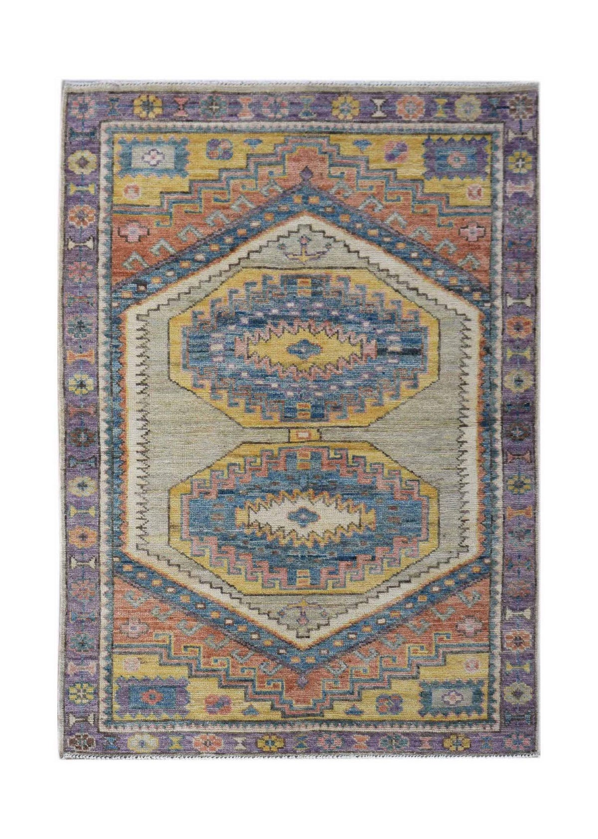 Hand-knotted Afghan Oushak rug featuring a geometric medallion design in muted blue, yellow, and terracotta wool.