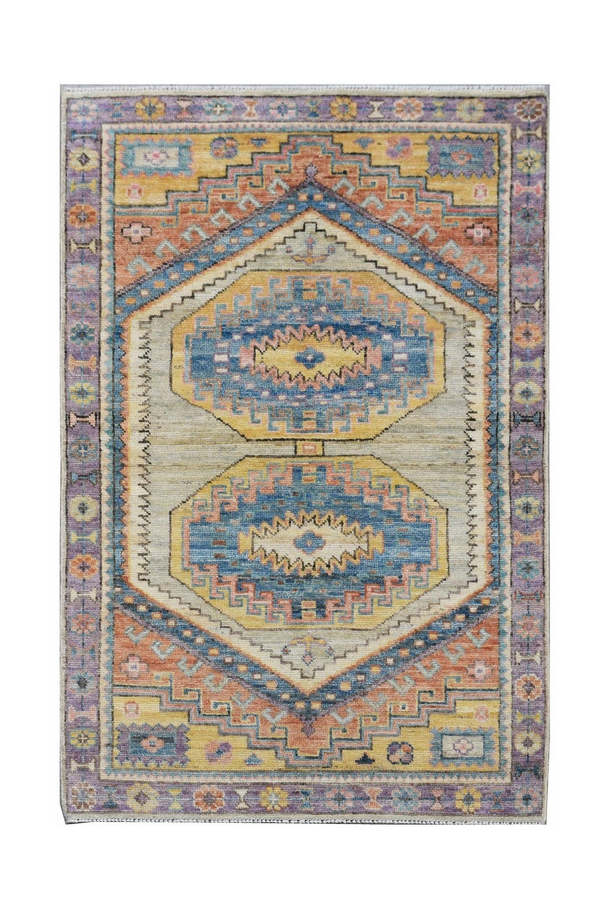Hand-knotted Afghan Oushak rug featuring a geometric medallion design in muted blue, yellow, and purple wool.