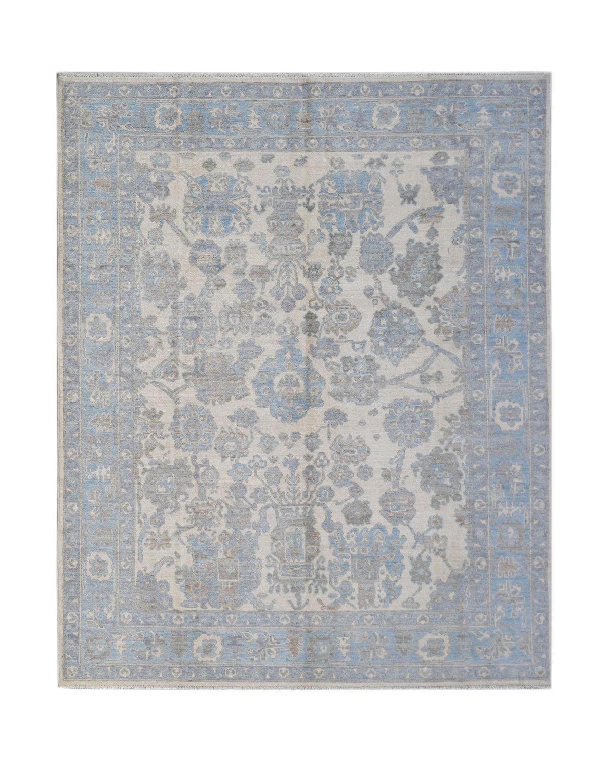 Hand-knotted Afghan Oushak rug featuring a soft blue and cream floral pattern with a refined low-pile wool finish.