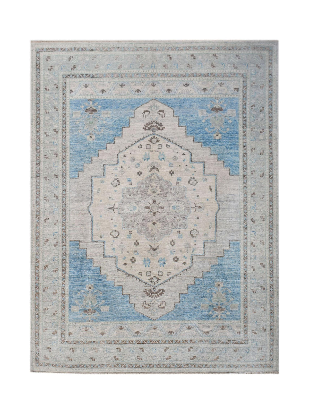 Hand-knotted Afghan Oushak rug featuring a large-scale central medallion in soft blue, cream, and muted grey wool.