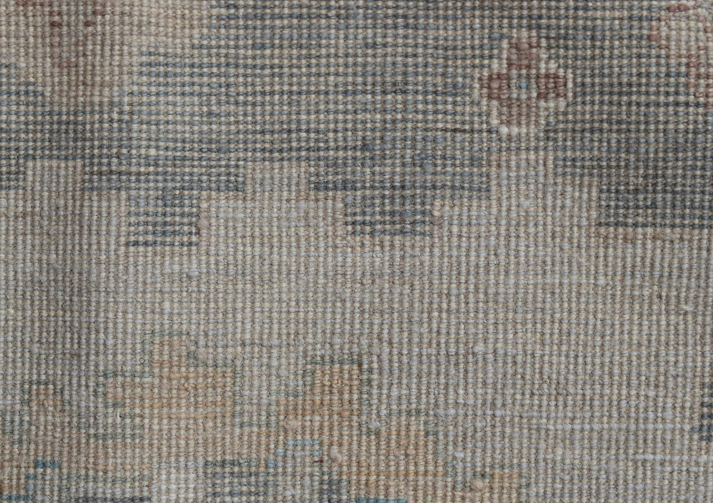 A handwoven transitional Oushak runner featuring a muted floral pattern in wool.