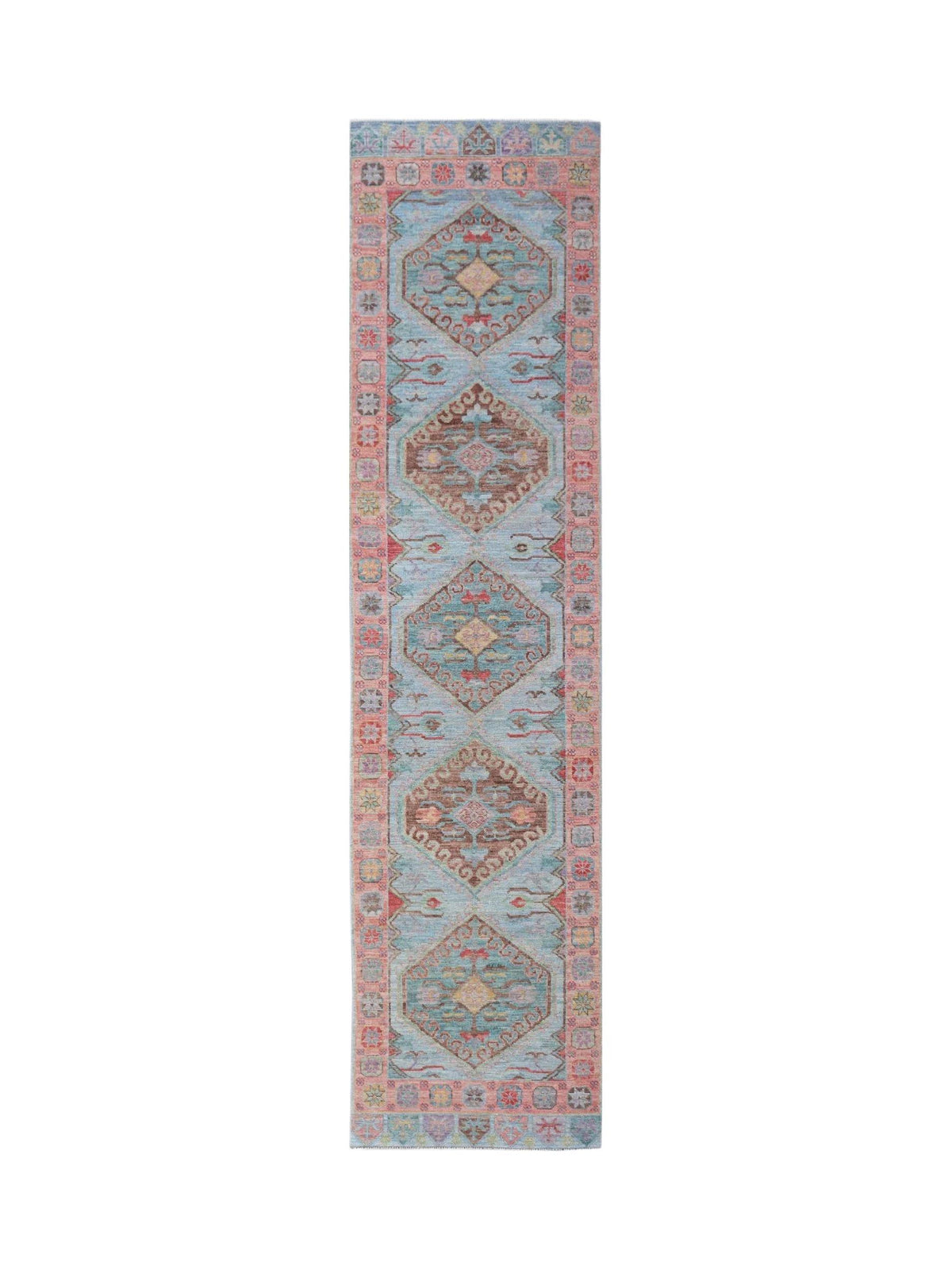 Hand-knotted Oushak runner with blue field, soft pink border, and spaced medallions in muted earth tones.