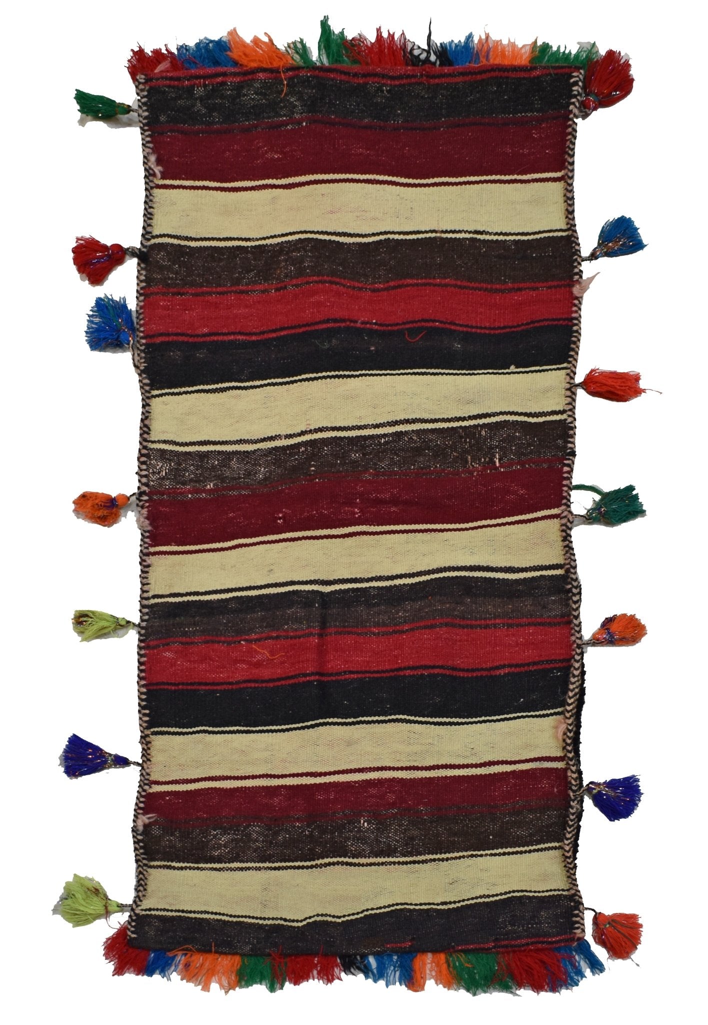 A vintage Afghan saddle bag featuring horizontal stripes in red, black, and cream with tassels.