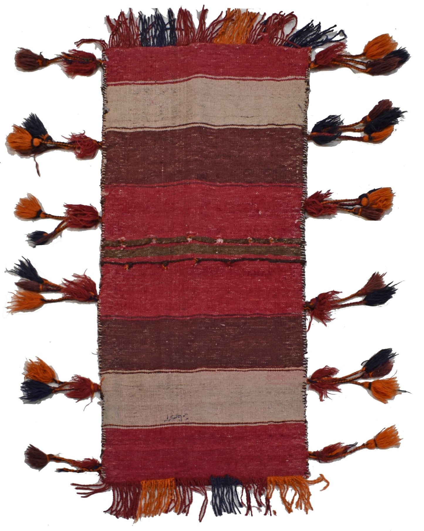 A vintage handmade Afghan wool saddle bag featuring horizontal stripes and decorative side tassels.