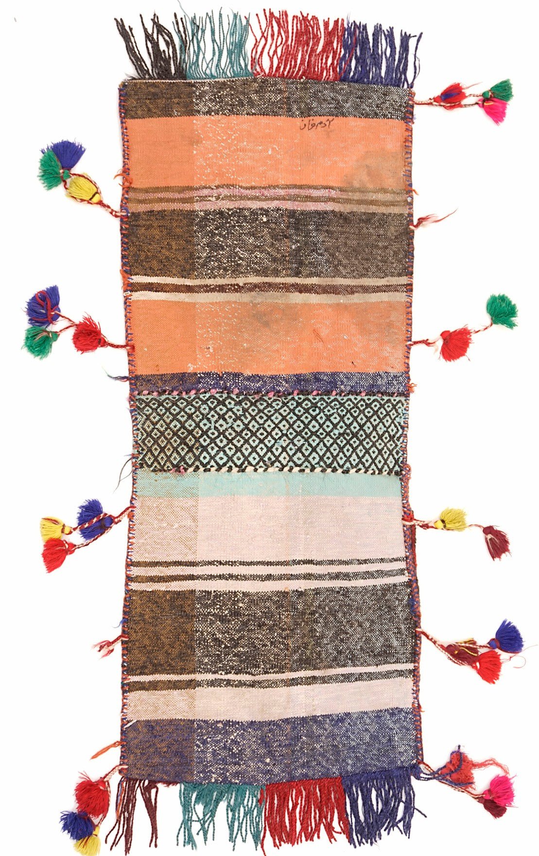 A vintage handmade Afghan wool saddle bag featuring colorful stripes, geometric patterns, and tassels.