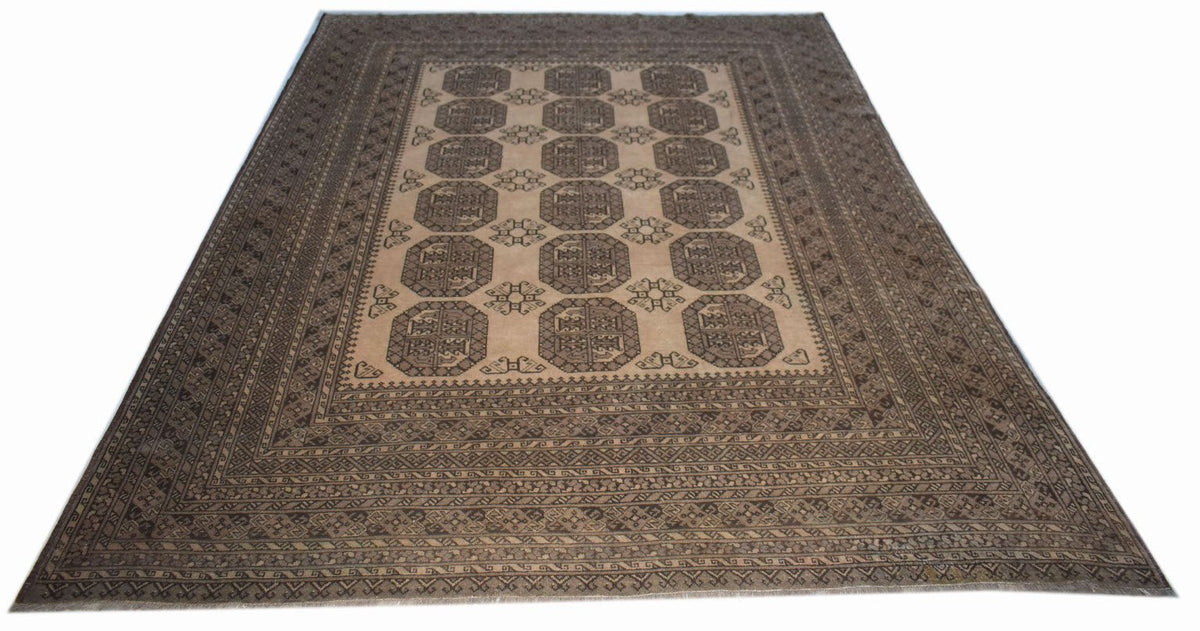 A vintage handmade Afghan Turkmen wool rug featuring a repeating octagonal pattern in brown tones.