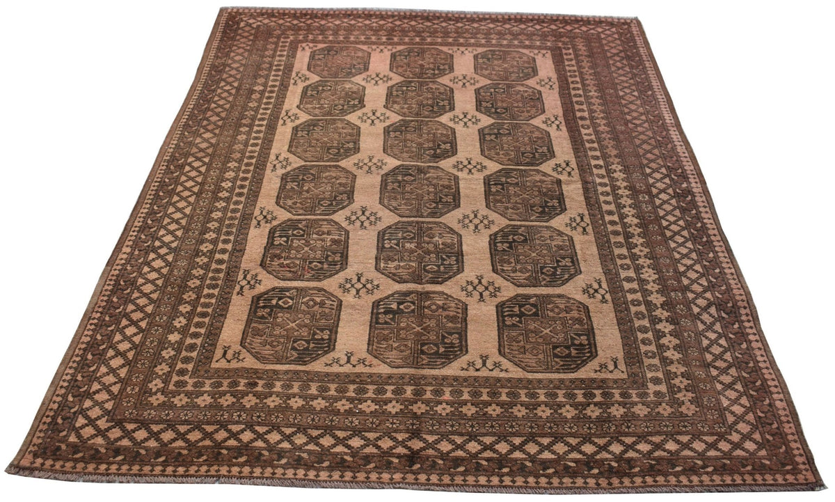 A vintage handmade Afghan Turkmen rug featuring a repeating octagonal pattern in brown tones.