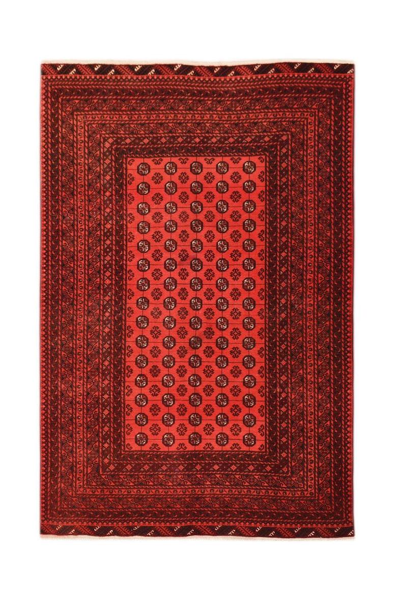 A vintage handmade Afghan Turkmen rug featuring a repeating red and black elephant foot motif.