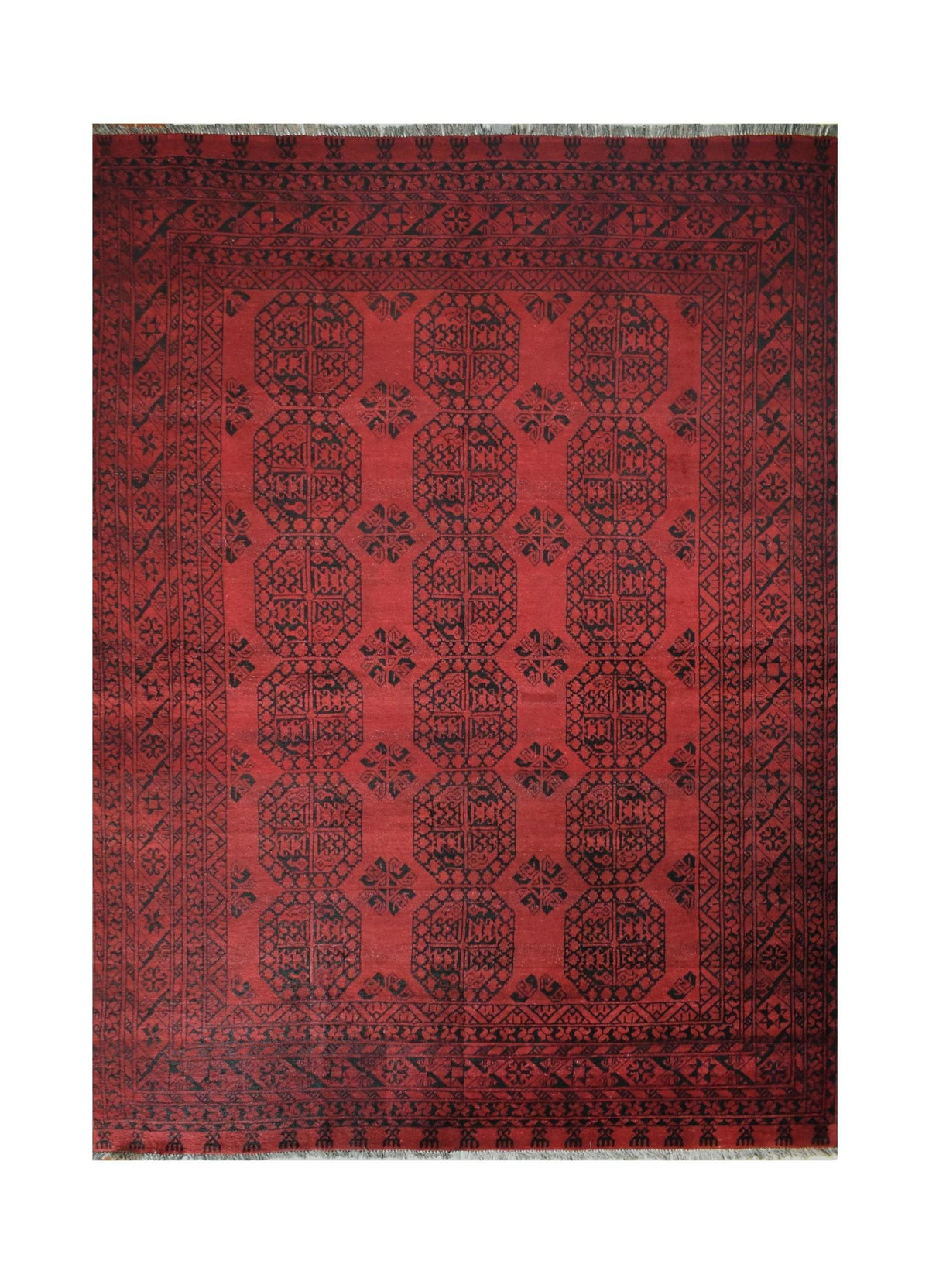 A vintage handmade Afghan Turkmen rug featuring a deep red field with repeating black octagons.