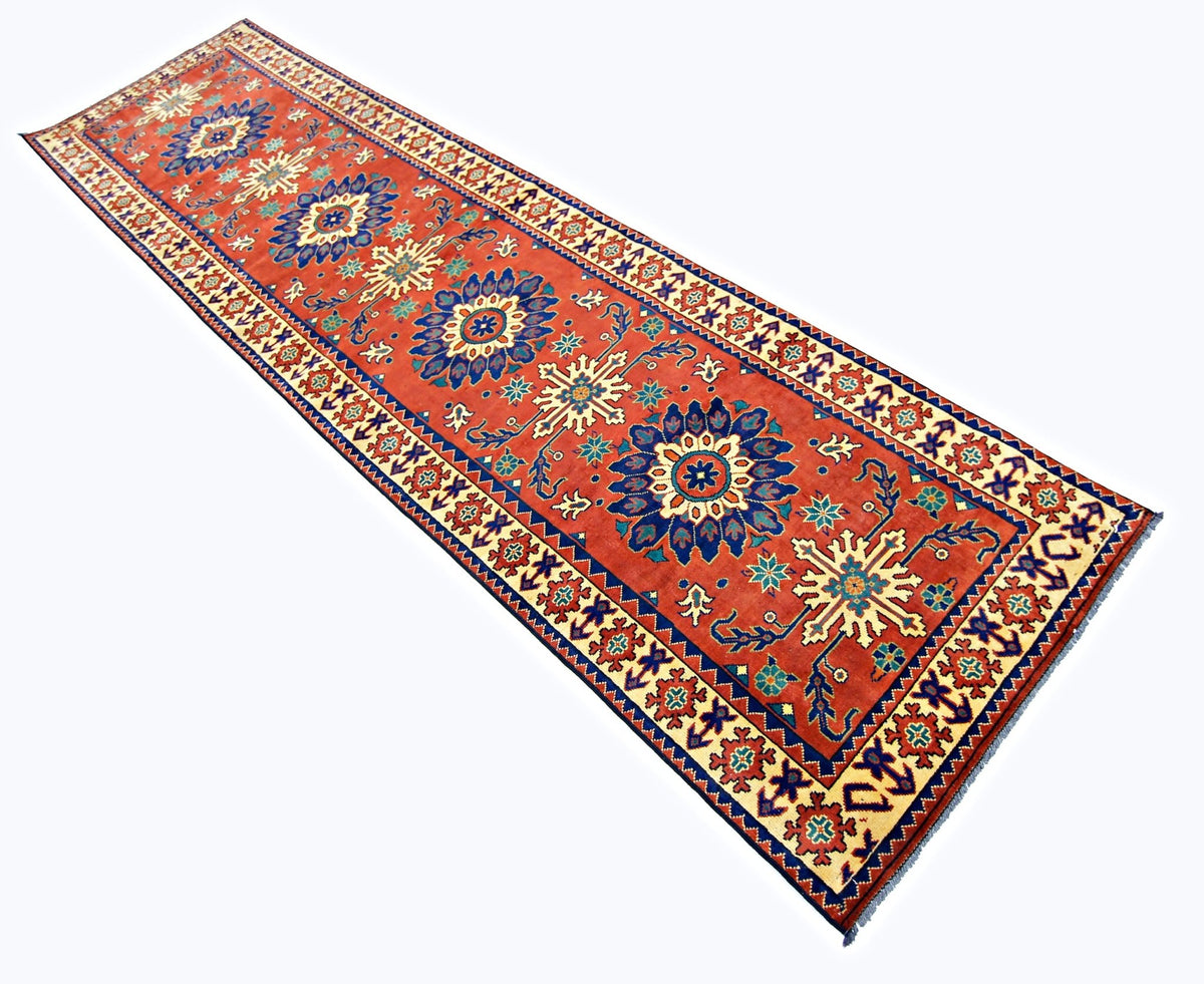Hand-knotted Afghan Turkmen runner in deep red with repeating blue and cream gul medallions and wool construction.