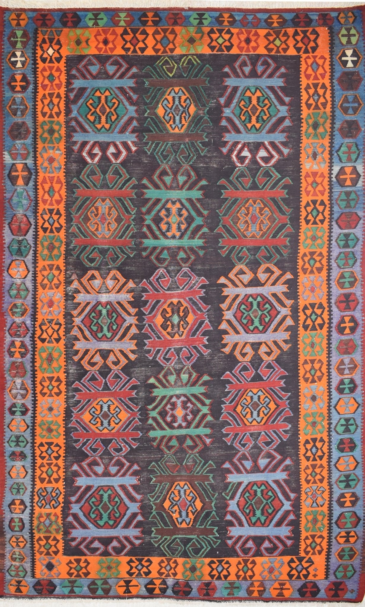 Vintage Caucasian Karabagh kilim featuring a dark field with colorful geometric tribal motifs.