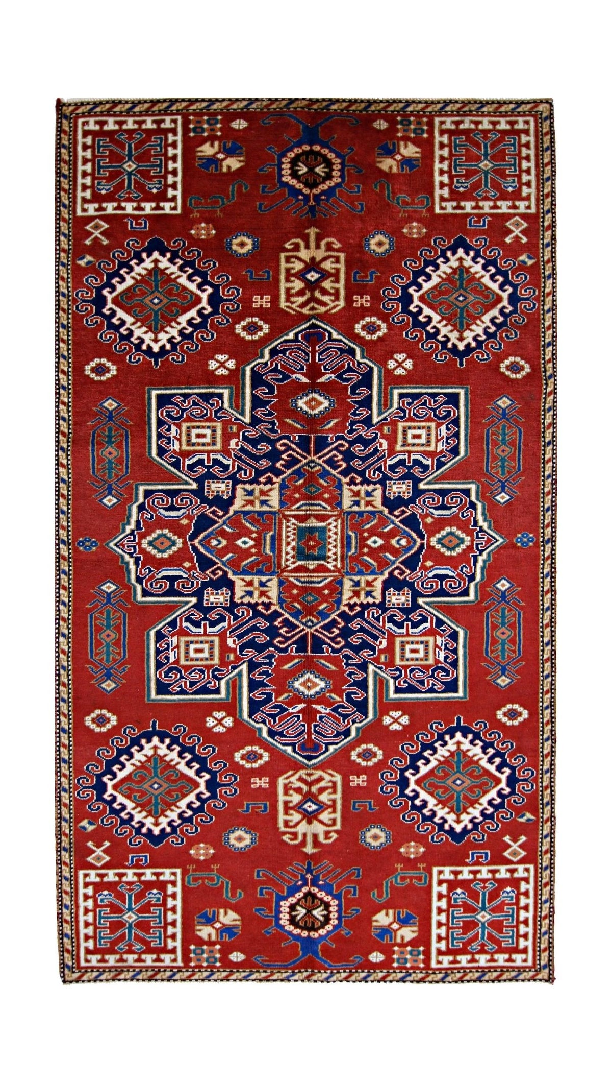 Vintage Caucasian Kazak rug with a bold red field, geometric blue medallions, and intricate hooked motifs.