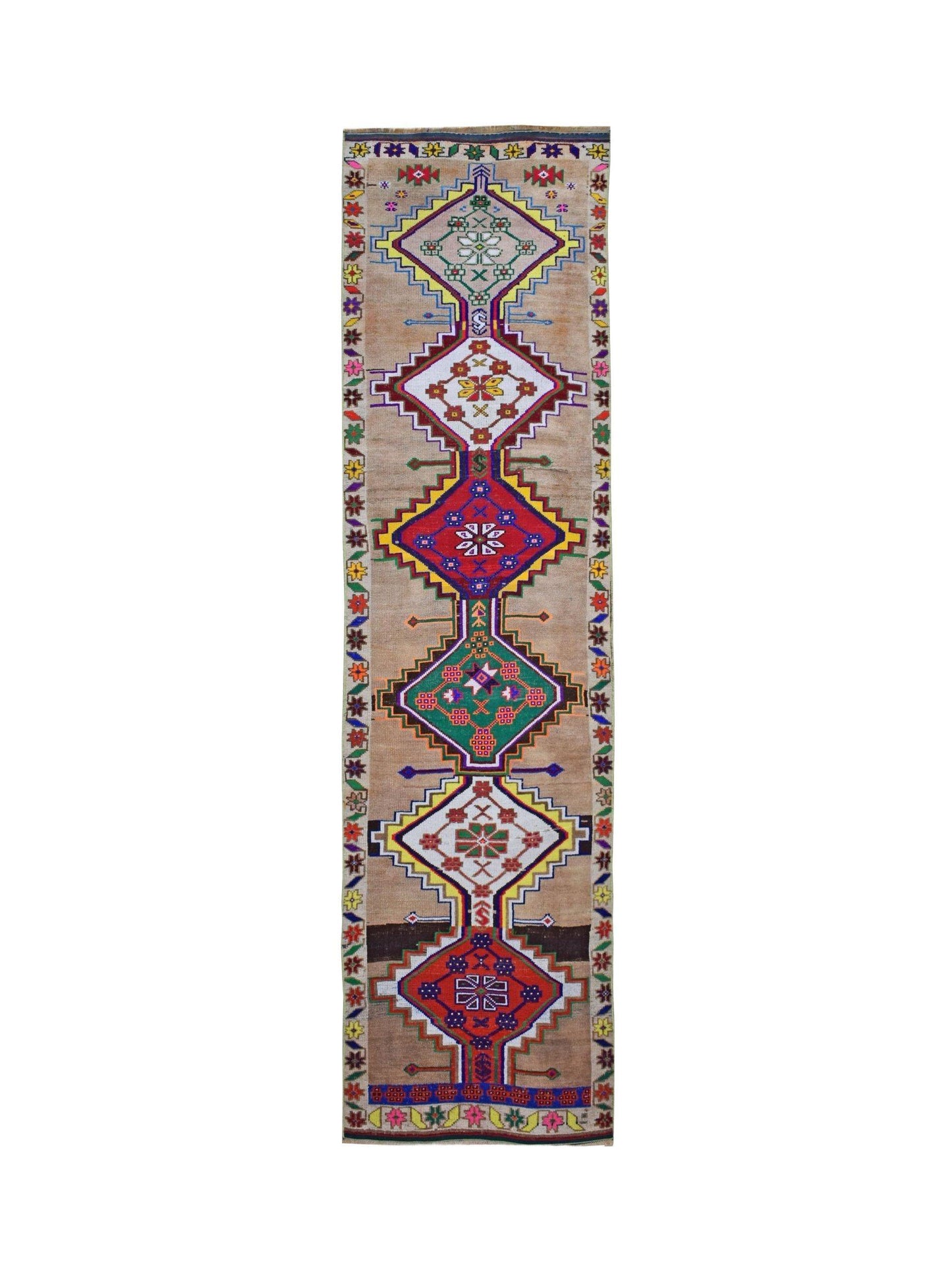 A vintage Kurdish Herki runner featuring tribal geometric motifs in vibrant colors on a tan base.
