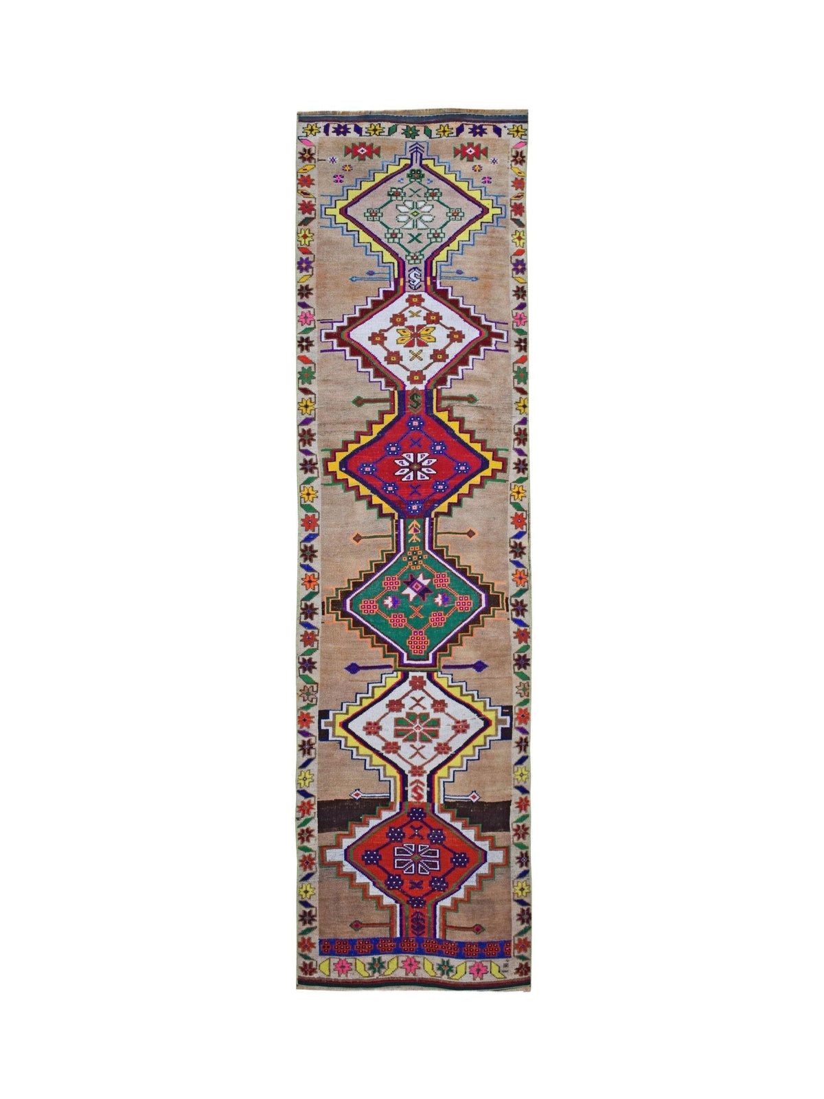 A vintage Kurdish Herki runner featuring tribal geometric motifs in vibrant colors on a tan base.