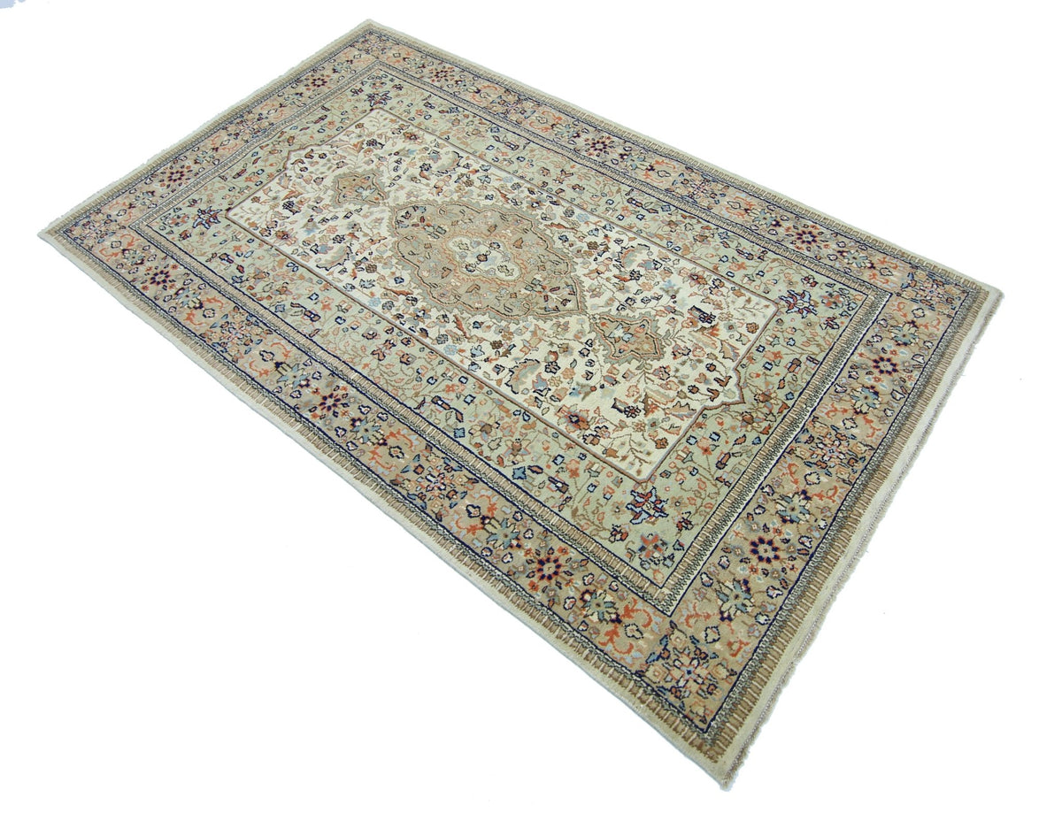 A vintage handmade Pakistani wool rug featuring an intricate floral pattern in neutral tones.