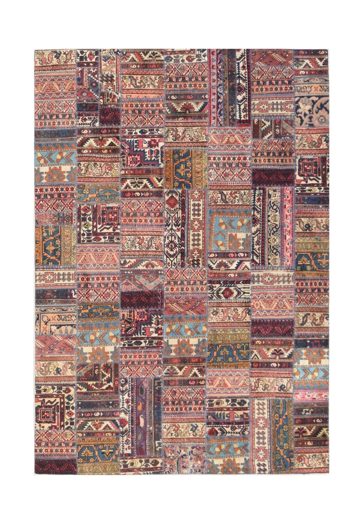 A rectangular handmade patchwork rug featuring a vibrant collage of vintage wool carpet fragments.
