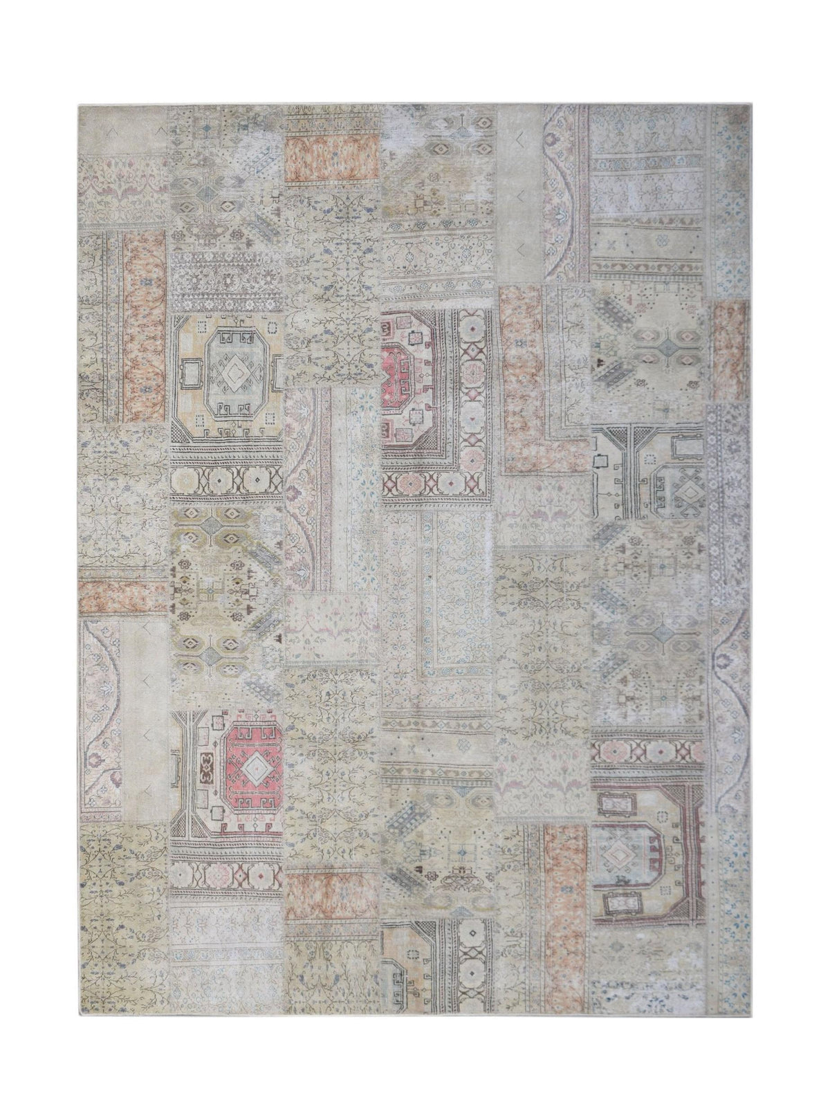 A handmade patchwork rug featuring a vintage-inspired design in muted neutral tones.