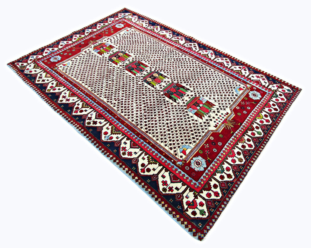 Vintage Persian Afshar rug with a cream lattice field, central geometric medallions, and a bold red and blue patterned border.