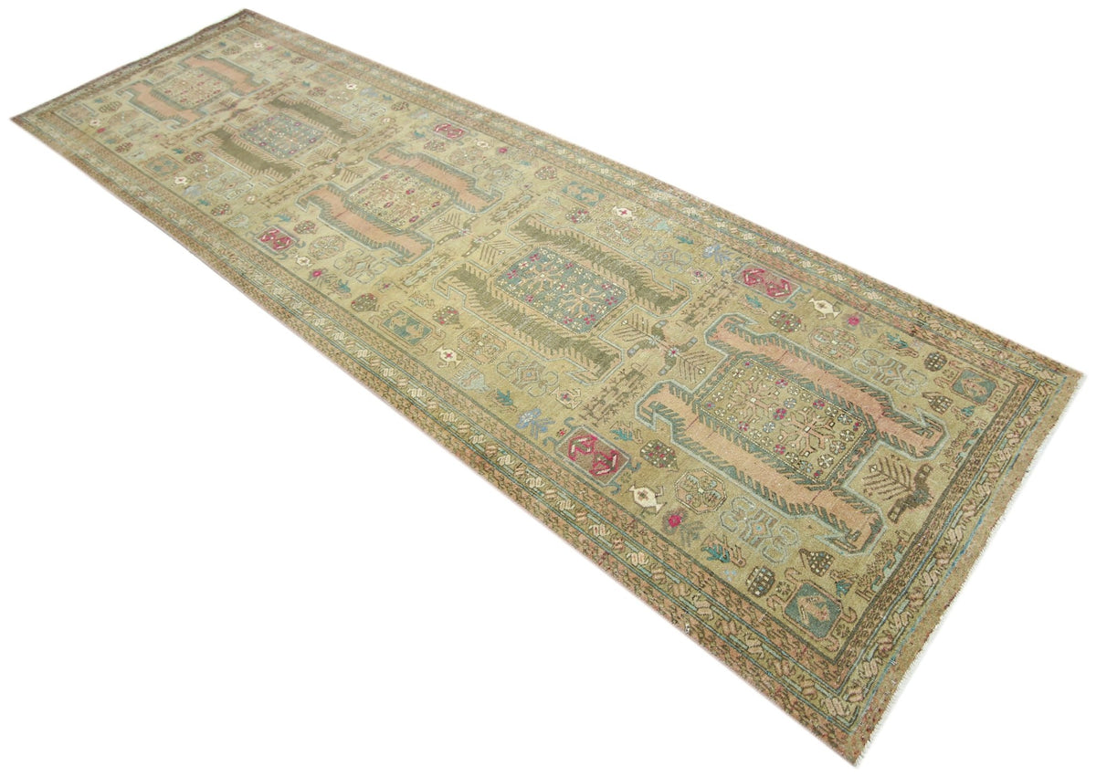 Vintage Persian Ardabil wool runner featuring intricate geometric motifs and faded earthy tones in a long, narrow format.