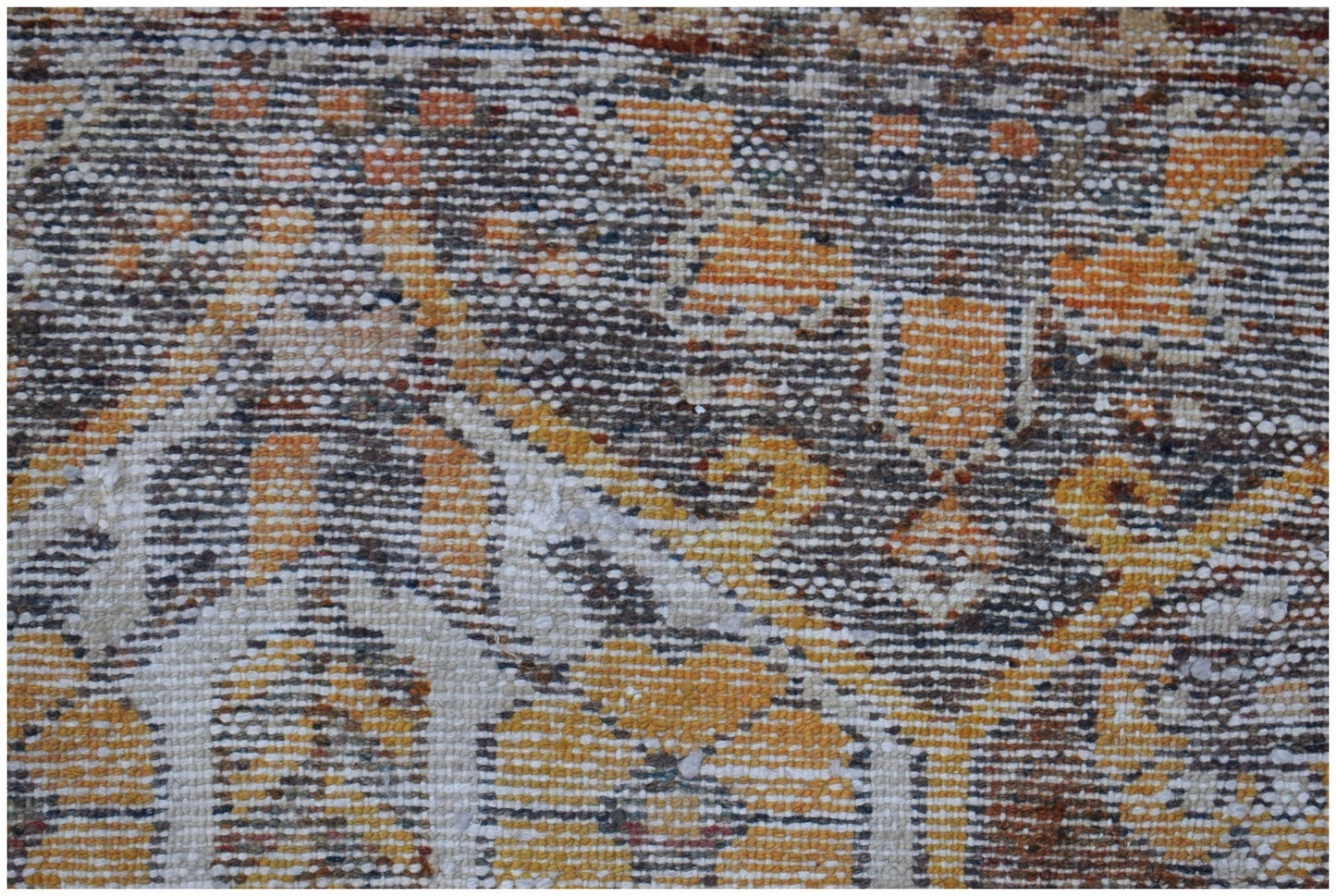 A close-up view of a vintage Persian Bakhtiari rug featuring intricate patterns in wool.