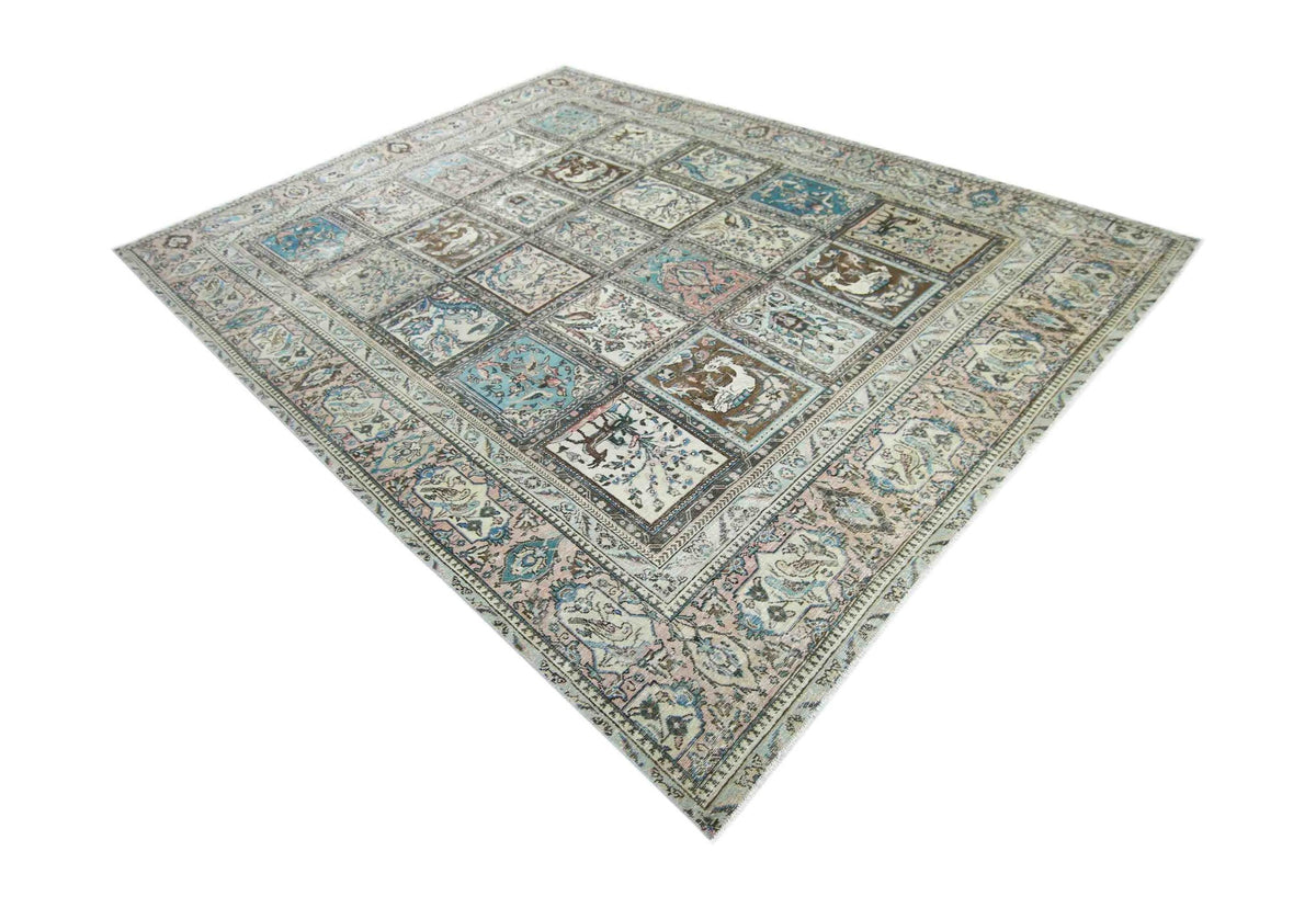 Vintage Persian Bakhtiari rug featuring a Khesti garden panel design in muted blue, pink, and brown tones on a white field.