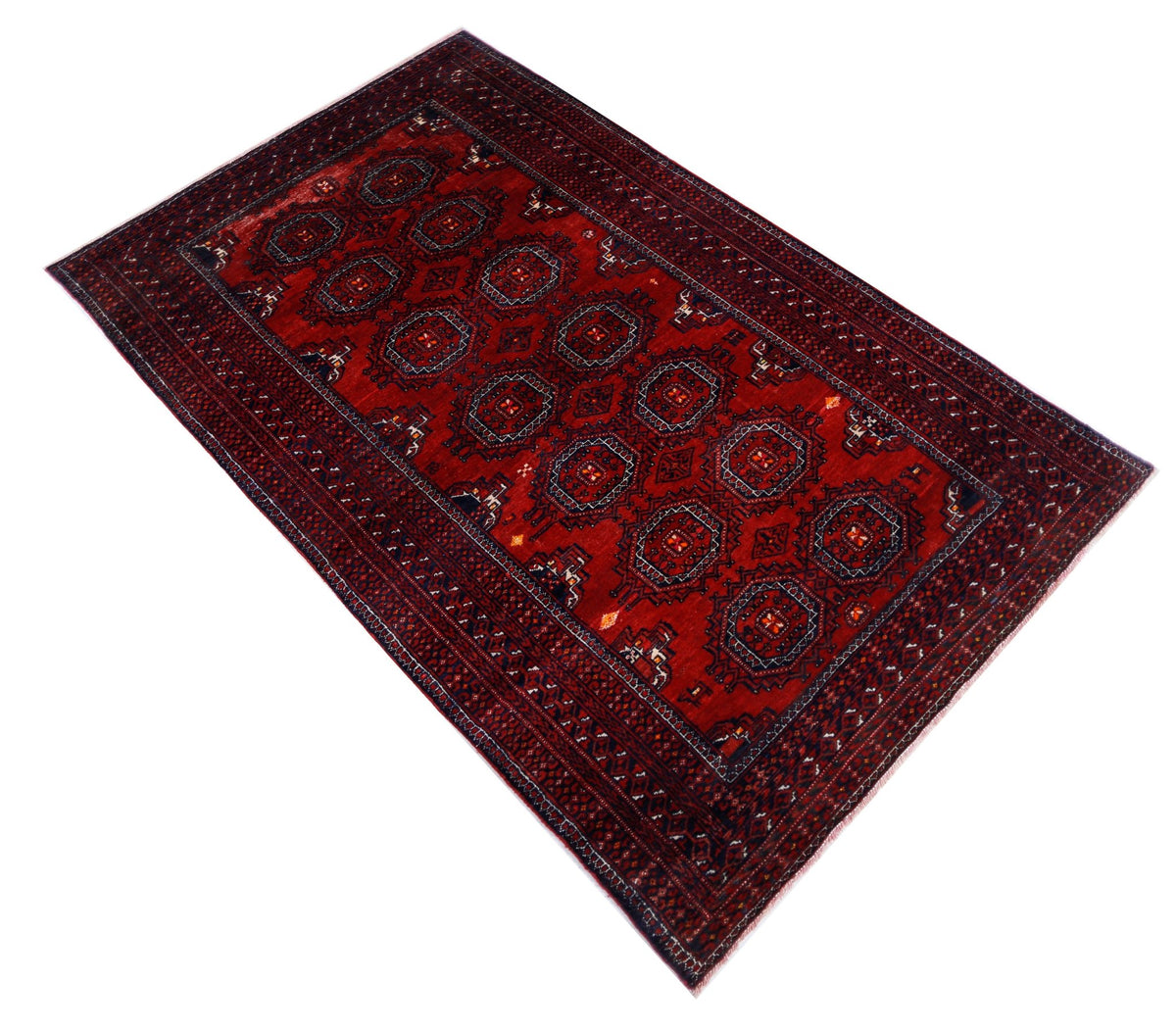 Hand-knotted vintage Persian Baluch rug featuring geometric medallions in deep earthy red and dark blue wool.