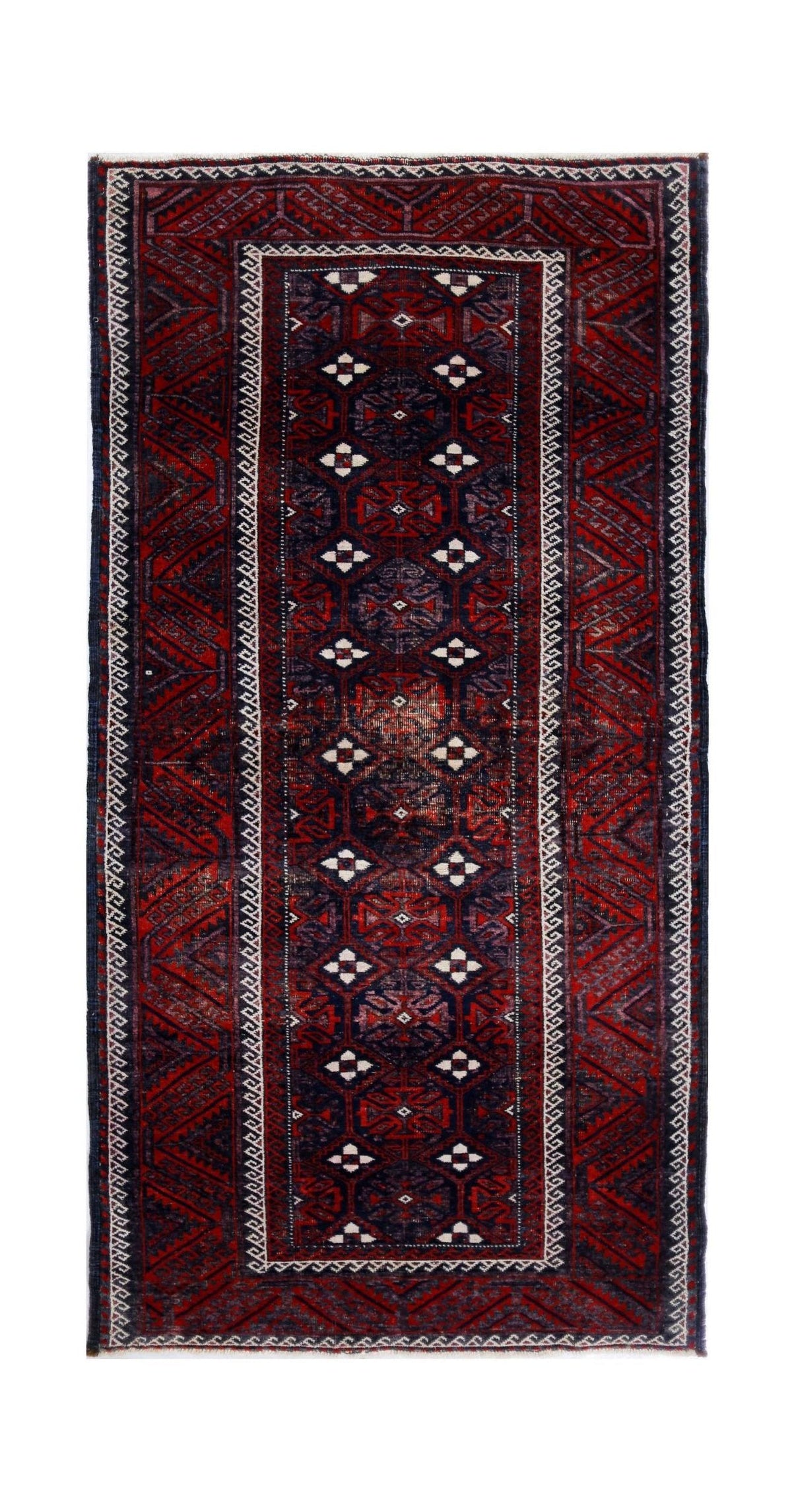 Hand-knotted vintage Persian Baluch rug featuring geometric medallions and diamond motifs in deep earthy red and navy tones.