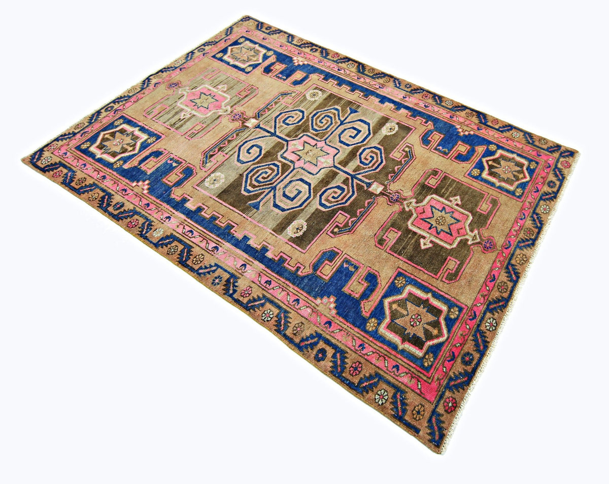 Hand-knotted vintage Persian Hamadan rug featuring a central medallion with blue, pink, and brown geometric tribal motifs.