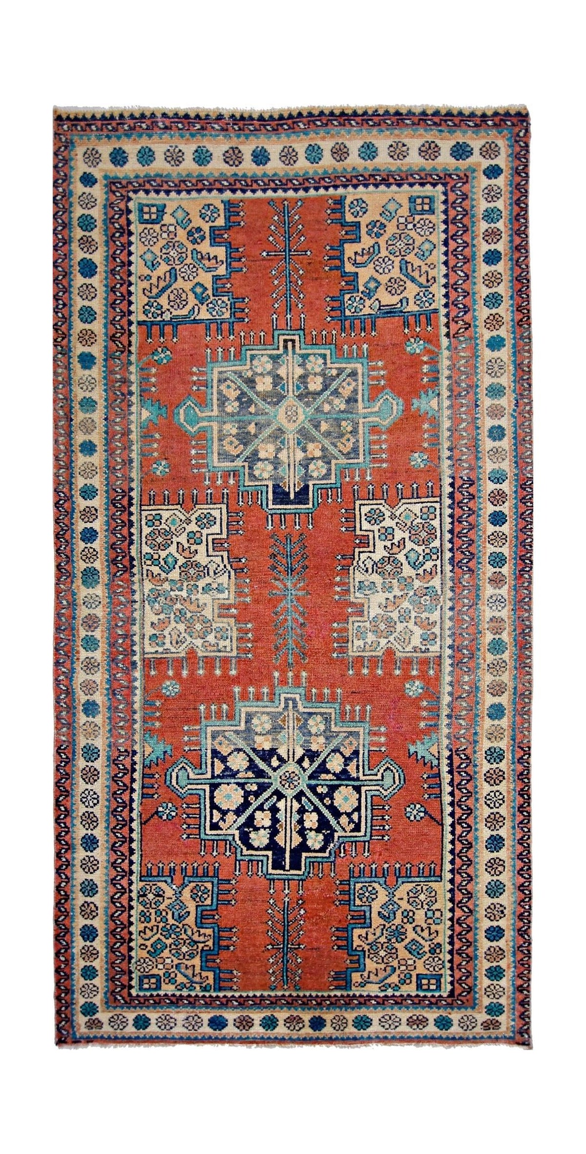 Hand-knotted vintage Persian Hamadan rug featuring geometric blue and cream medallions on a terracotta red field.