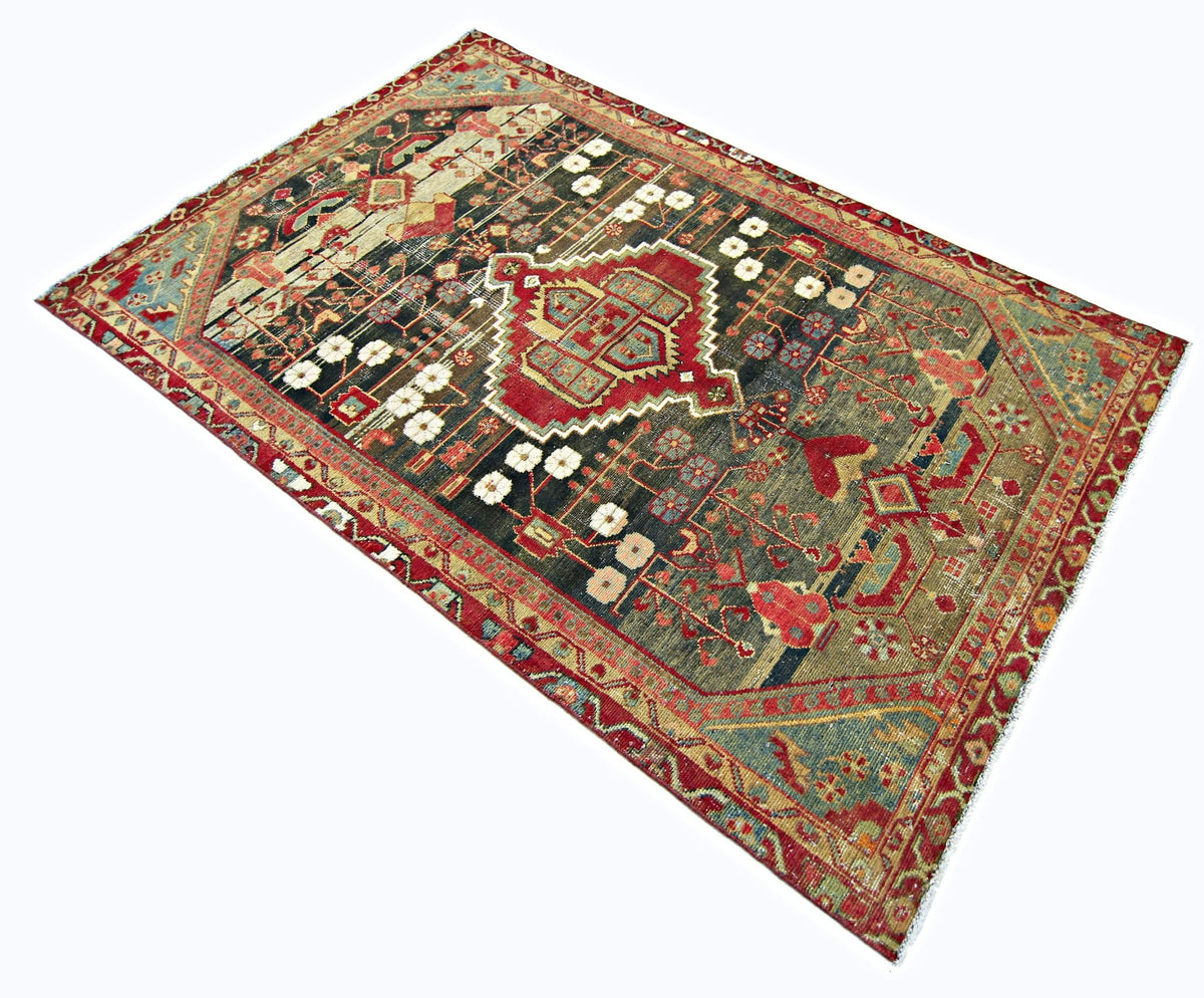 Hand-knotted vintage Persian Hamadan rug featuring a central red medallion, floral motifs, and a dark field with red borders.