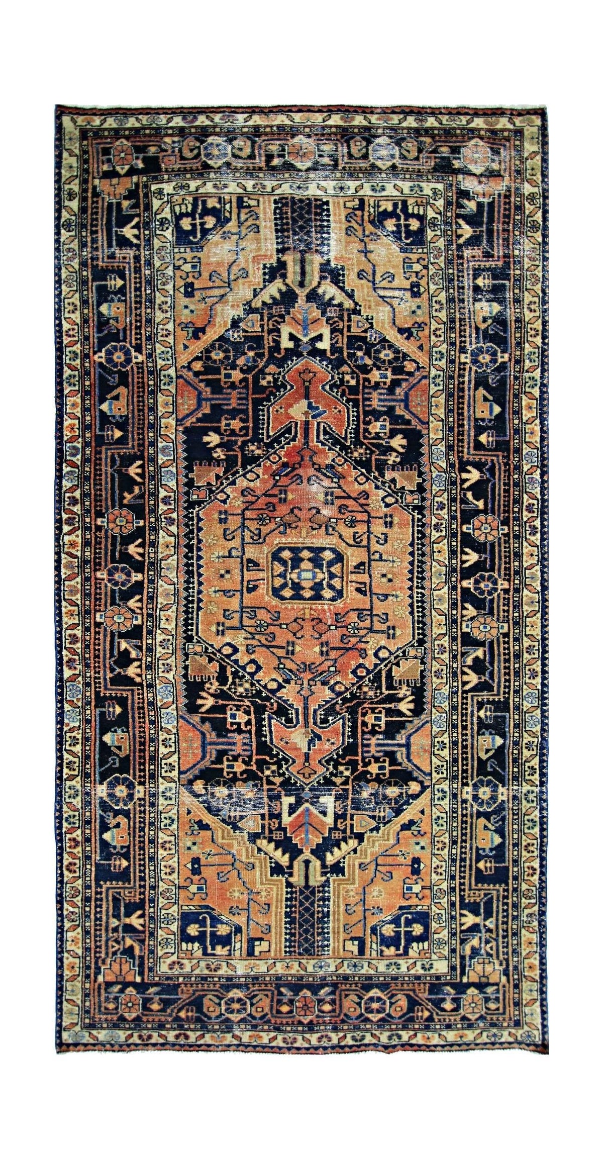 Hand-knotted vintage Hamadan rug featuring a central orange hexagonal medallion on a dark blue field with tribal motifs.