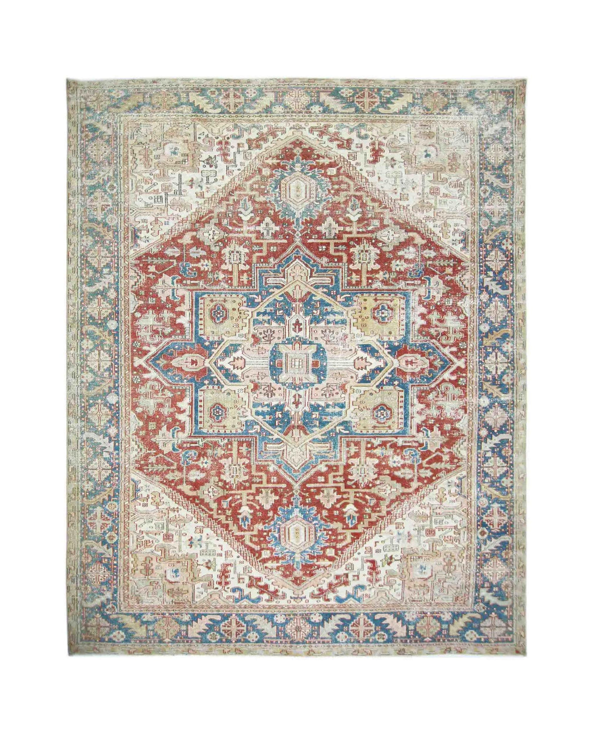 Vintage Persian Heriz rug featuring a large red and blue geometric central medallion on a cream field with ornate borders.