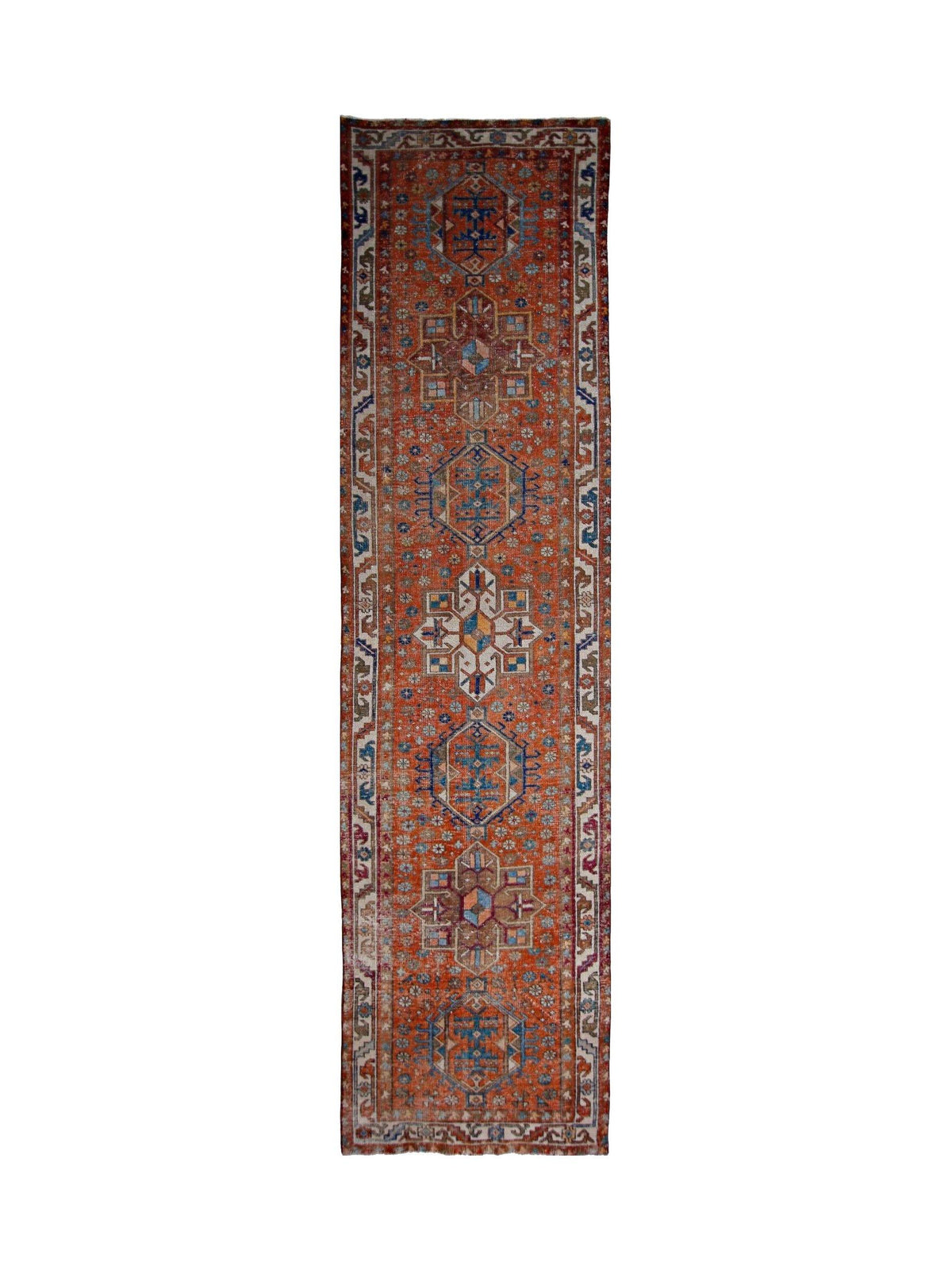 Hand-knotted vintage Persian Karaja runner featuring stacked geometric medallions in red, blue, and ivory wool.