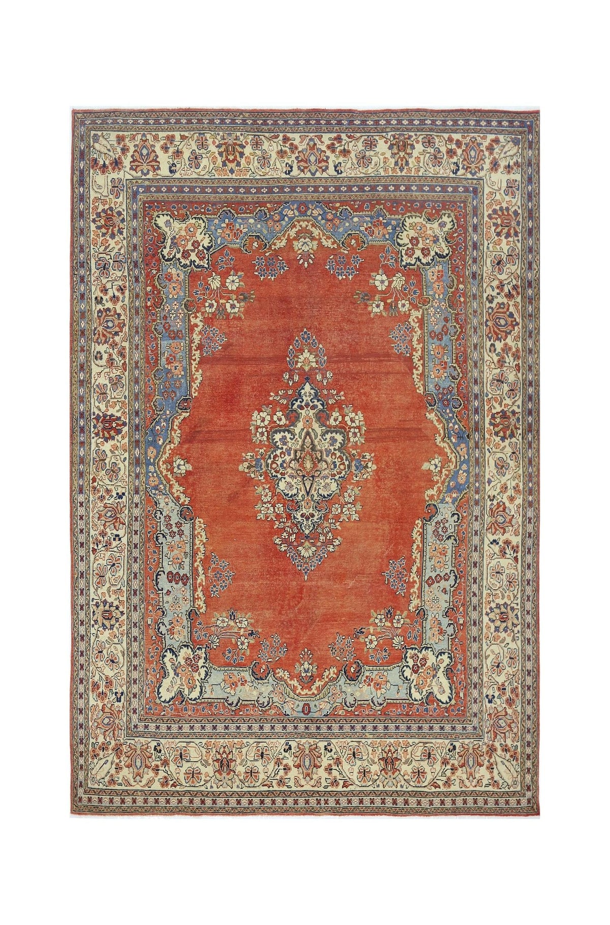 A vintage Persian Tabriz rug featuring a central floral medallion on a red field with blue borders.