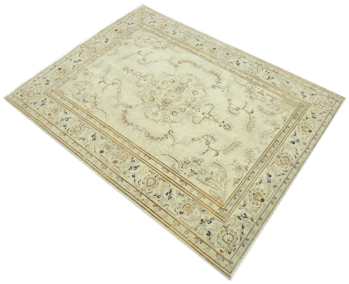 Vintage Persian Kerman rug with a cream floral field, central medallion, and intricate border on a cotton foundation.