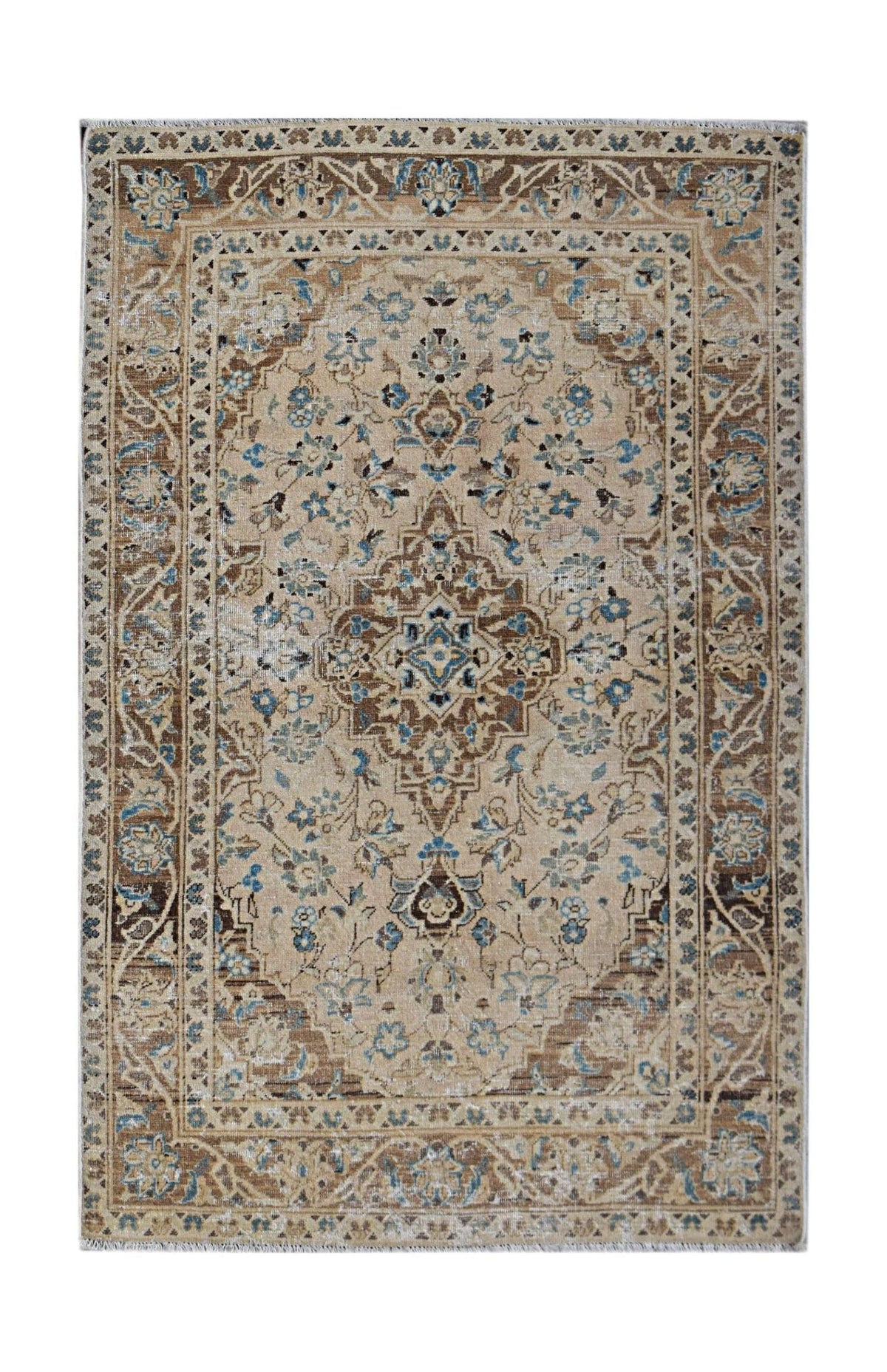Vintage Persian Kerman rug featuring an intricate floral medallion design in soft blue and brown tones on a beige field.