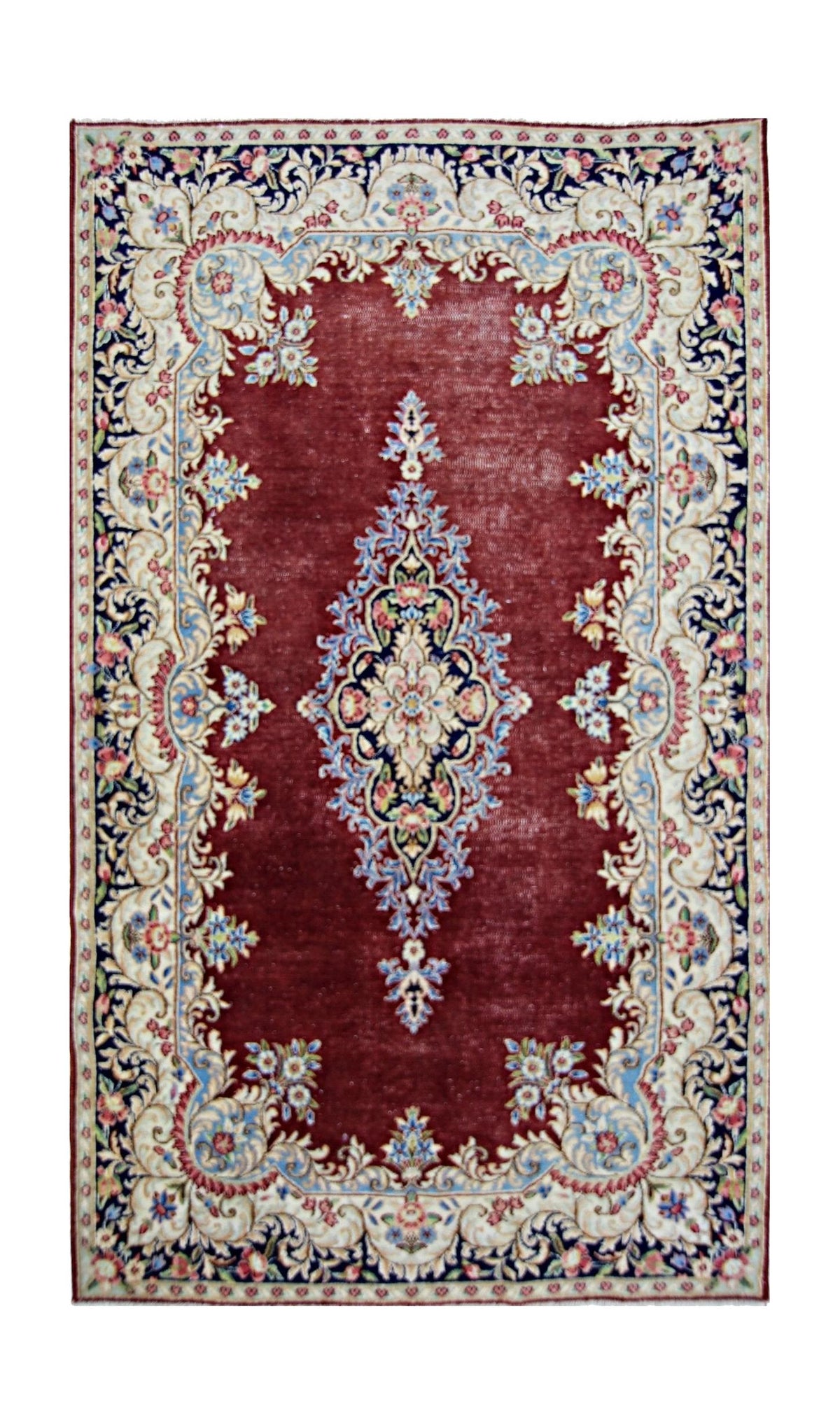 Vintage Persian Kerman rug featuring a deep red field, intricate central floral medallion, and ornate cream-toned borders.