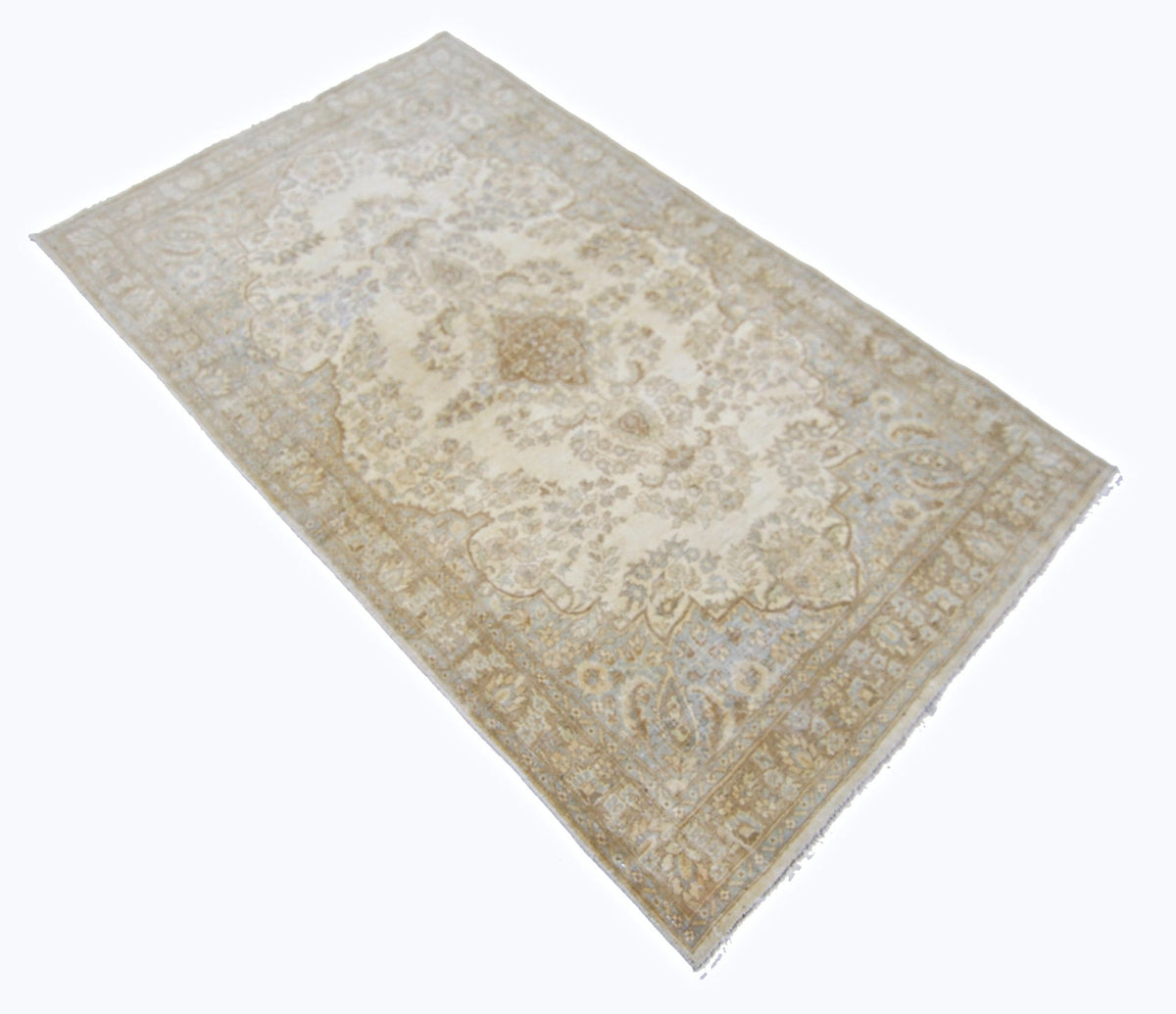 Vintage hand-knotted Persian Kerman rug in cream and beige with an intricate floral medallion and ornate border.