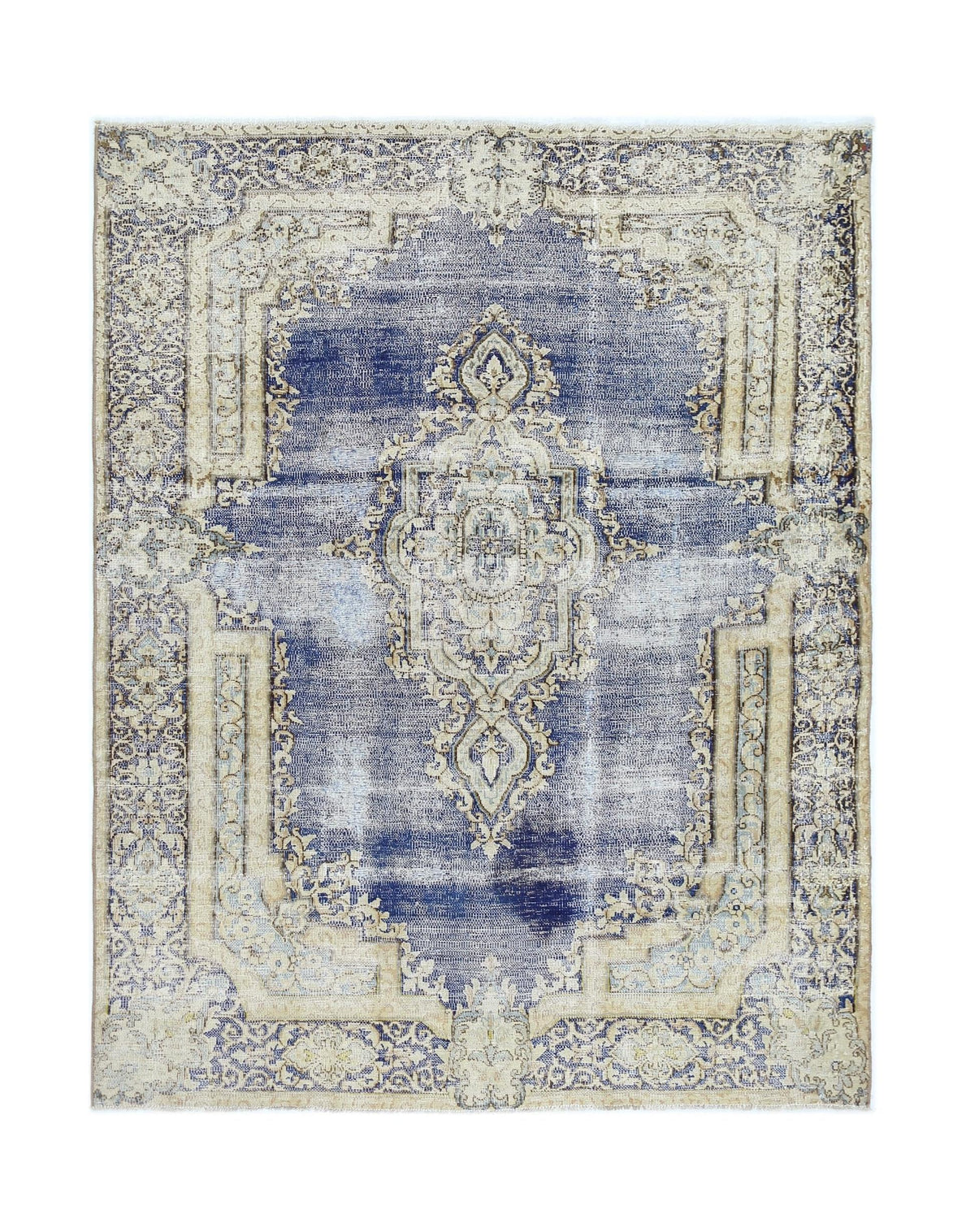 A vintage Persian Kerman rug featuring a central medallion and floral motifs in blue and beige.