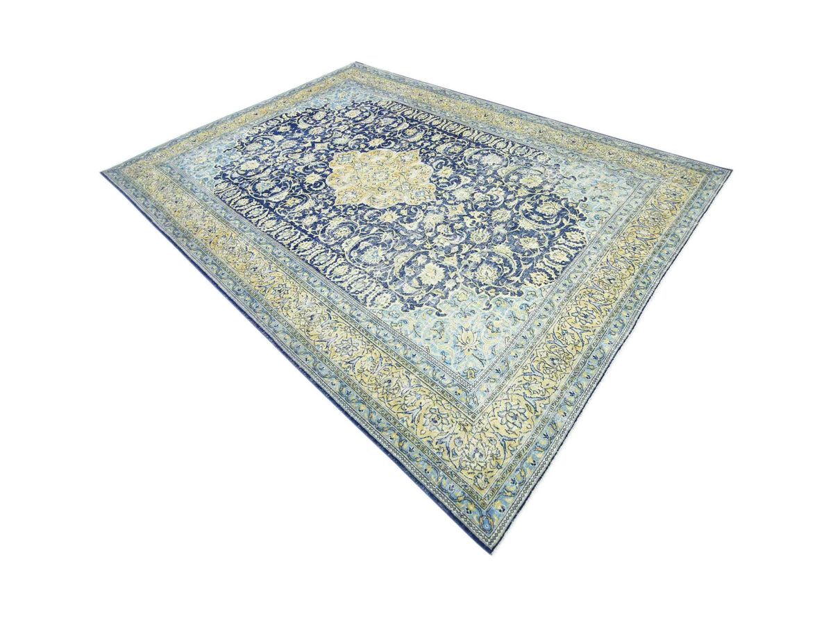 Vintage Persian Kerman wool rug with an intricate blue and cream floral medallion pattern on a cotton foundation.
