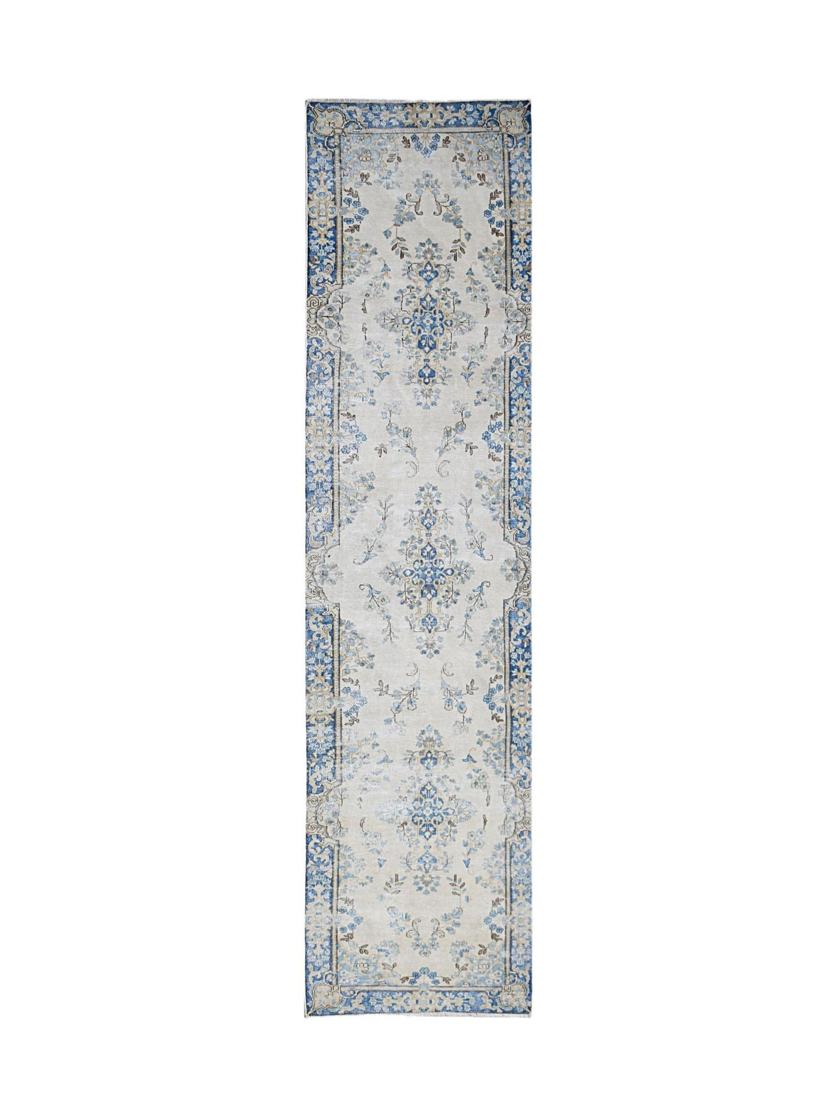 Vintage Persian Kerman runner featuring intricate blue and cream floral vine patterns with detailed decorative borders.