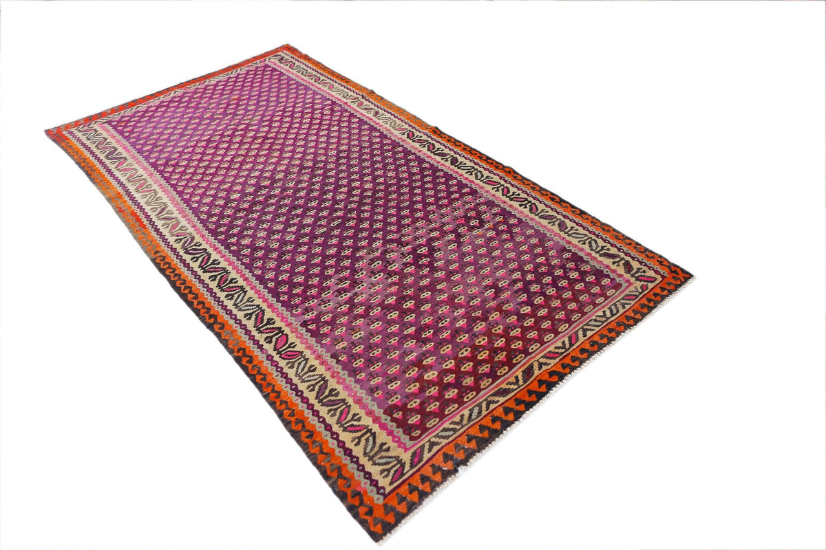 Vintage Persian Kurdish kilim with a magenta field, repeating geometric motifs, and a multi-coloured decorative border.