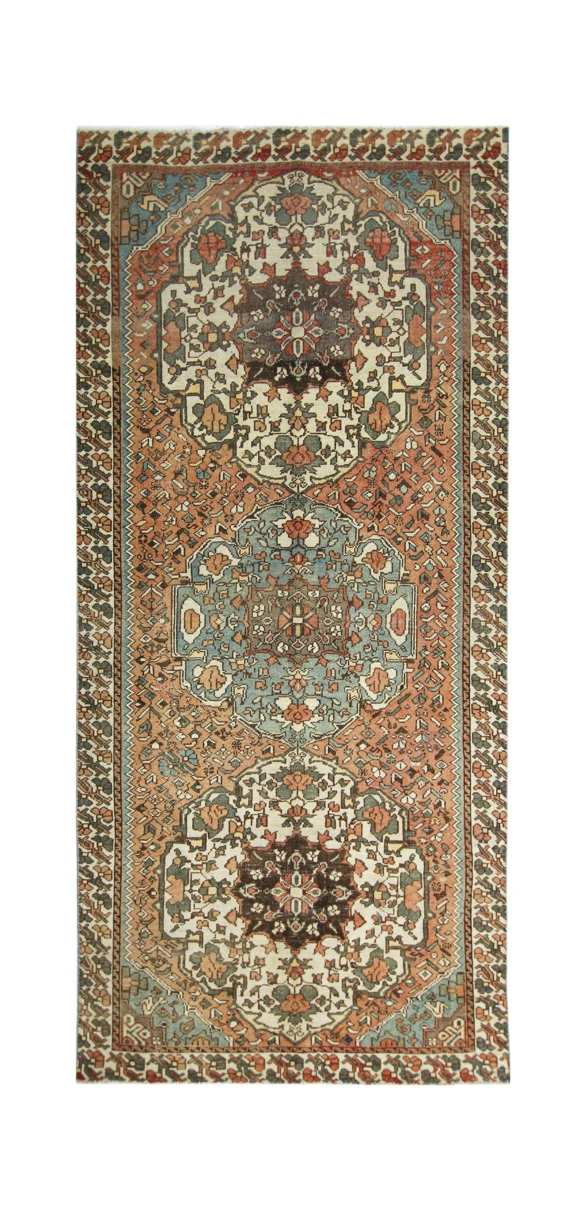 Vintage Persian Meshkin rug featuring three central medallions in indigo blue and madder red on a warm, patterned wool field.