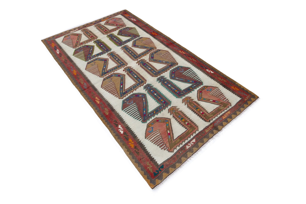 Handwoven vintage Persian Qashqai kilim with geometric tribal motifs in red, blue, and cream on a flat-woven wool rug.