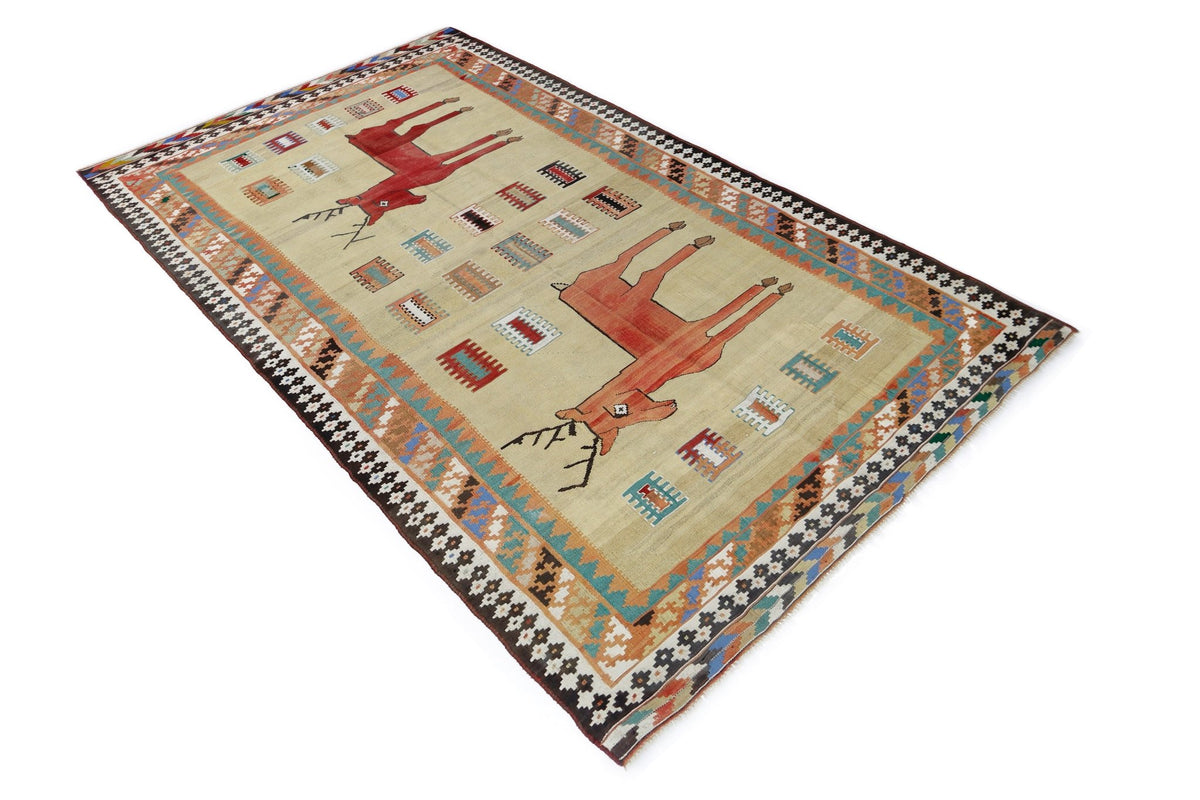 Handwoven vintage Persian Qashqai kilim in beige wool featuring two red deer motifs and a geometric patterned border.