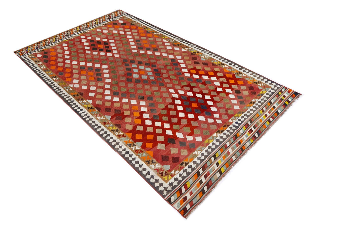 Handwoven vintage Persian Qashqai kilim featuring a red diamond pattern with colourful geometric accents and fringed edges.