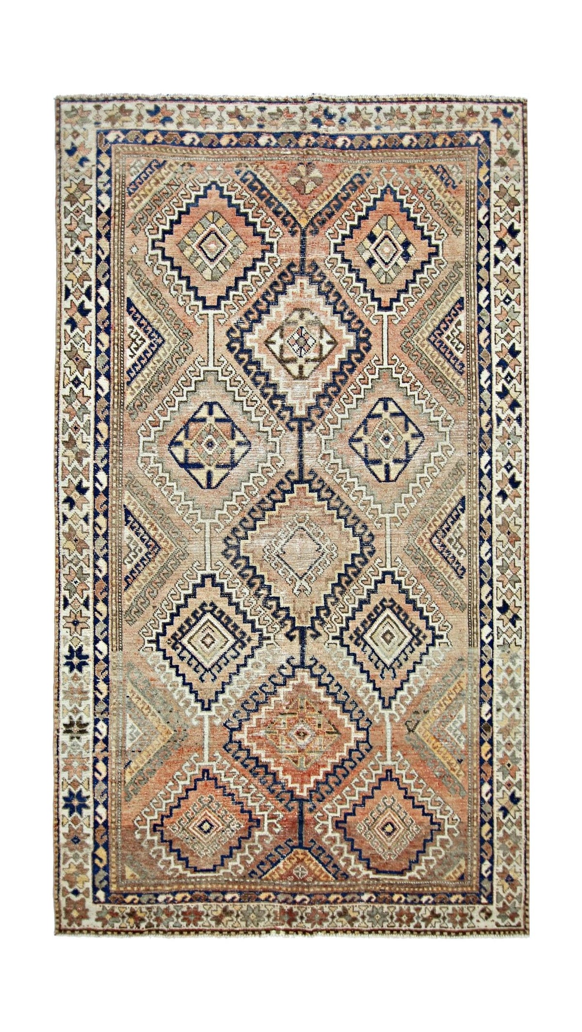 Vintage Persian Qashqai rug featuring a geometric diamond pattern in soft terracotta, navy, and cream wool.