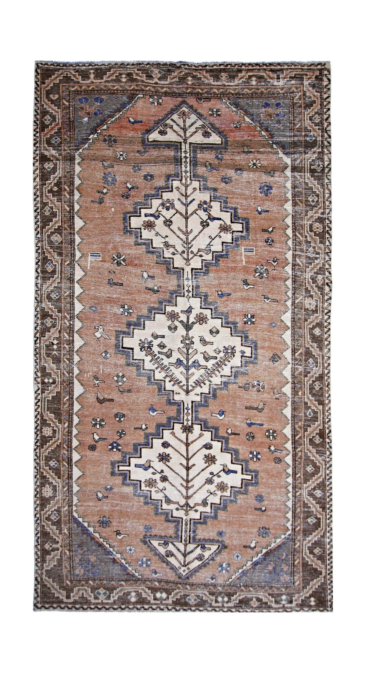 Vintage Persian Qashqai rug featuring three central diamond medallions with tree motifs in earthy brown, cream, and blue tones.